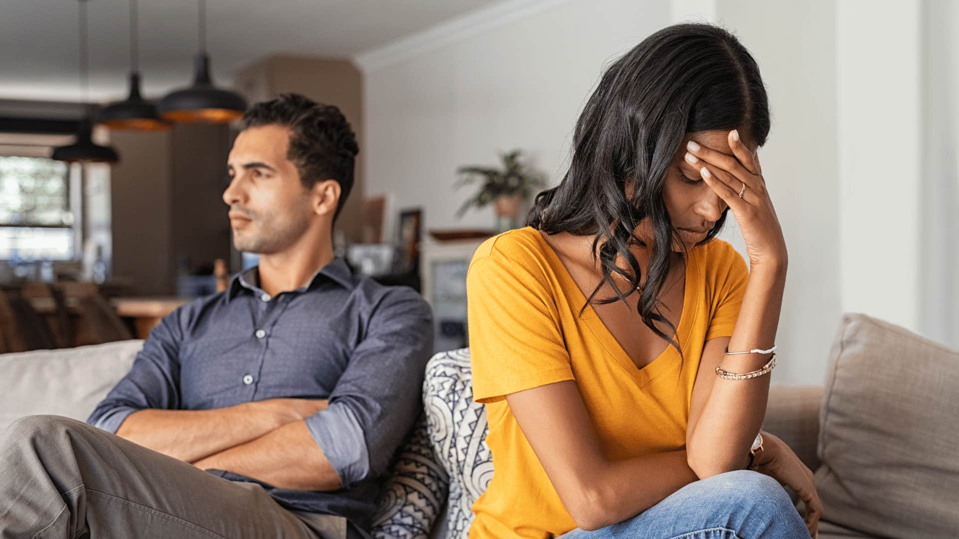 couple not talking while sitting next to each other