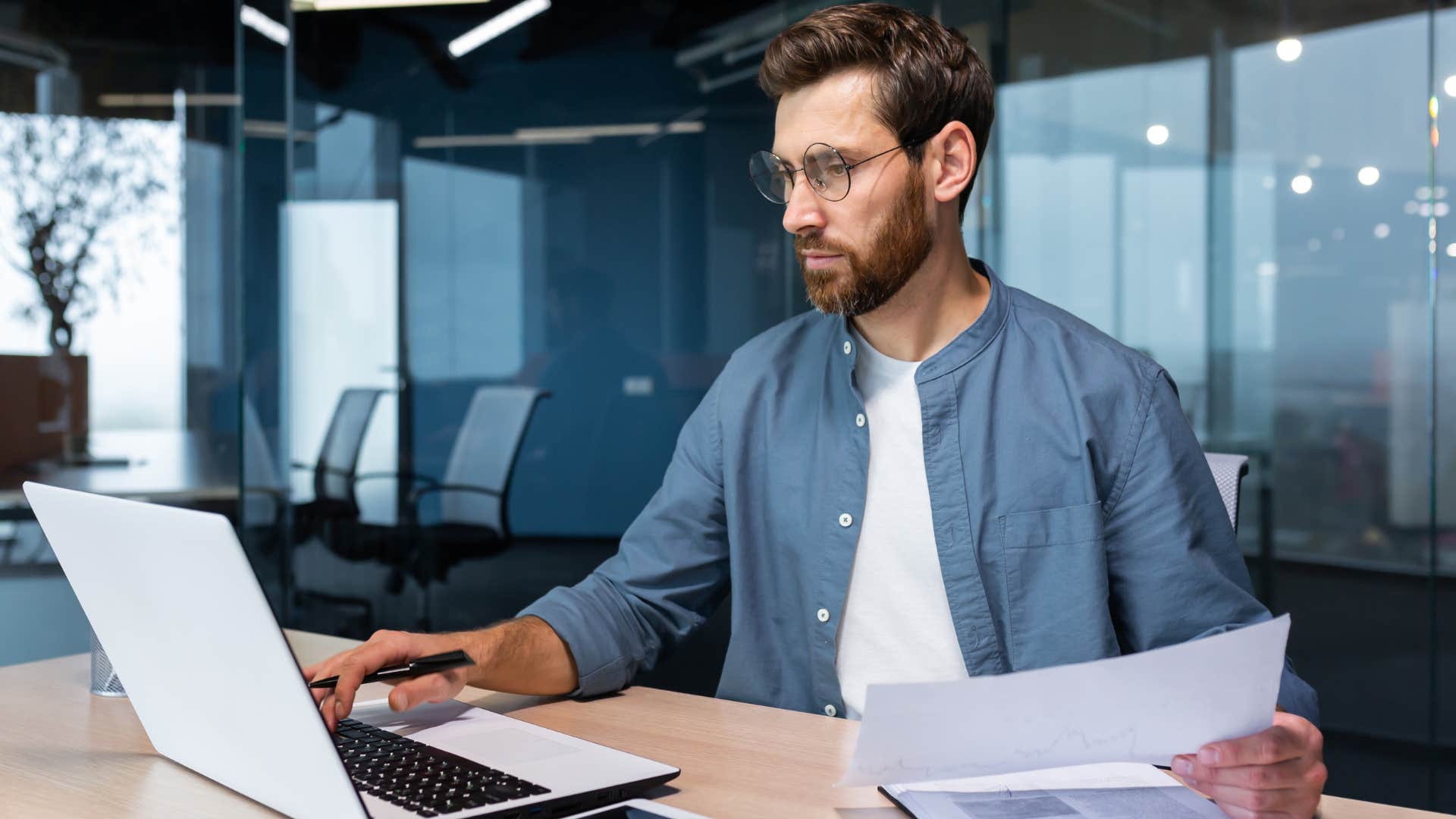 Gen Z man working at his desk in an office