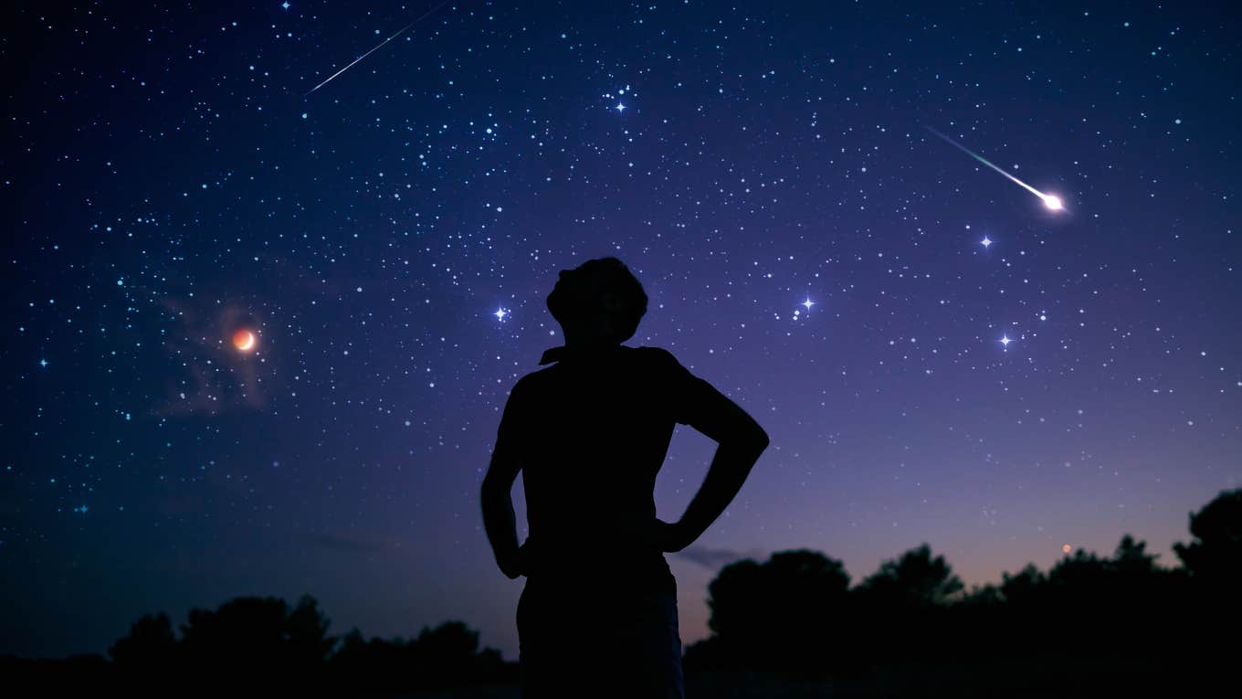 man staring at night sky