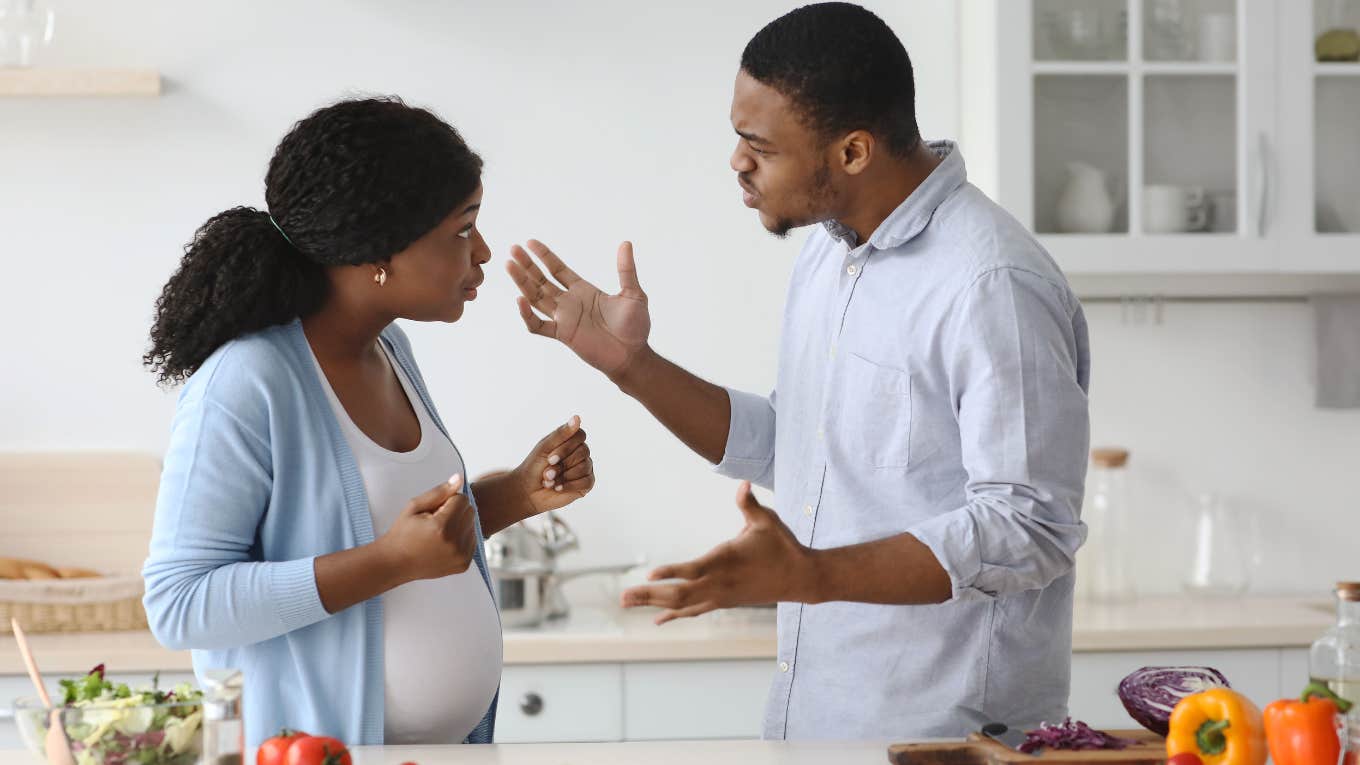 pregnant wife and husband arguing while she cooks dinner