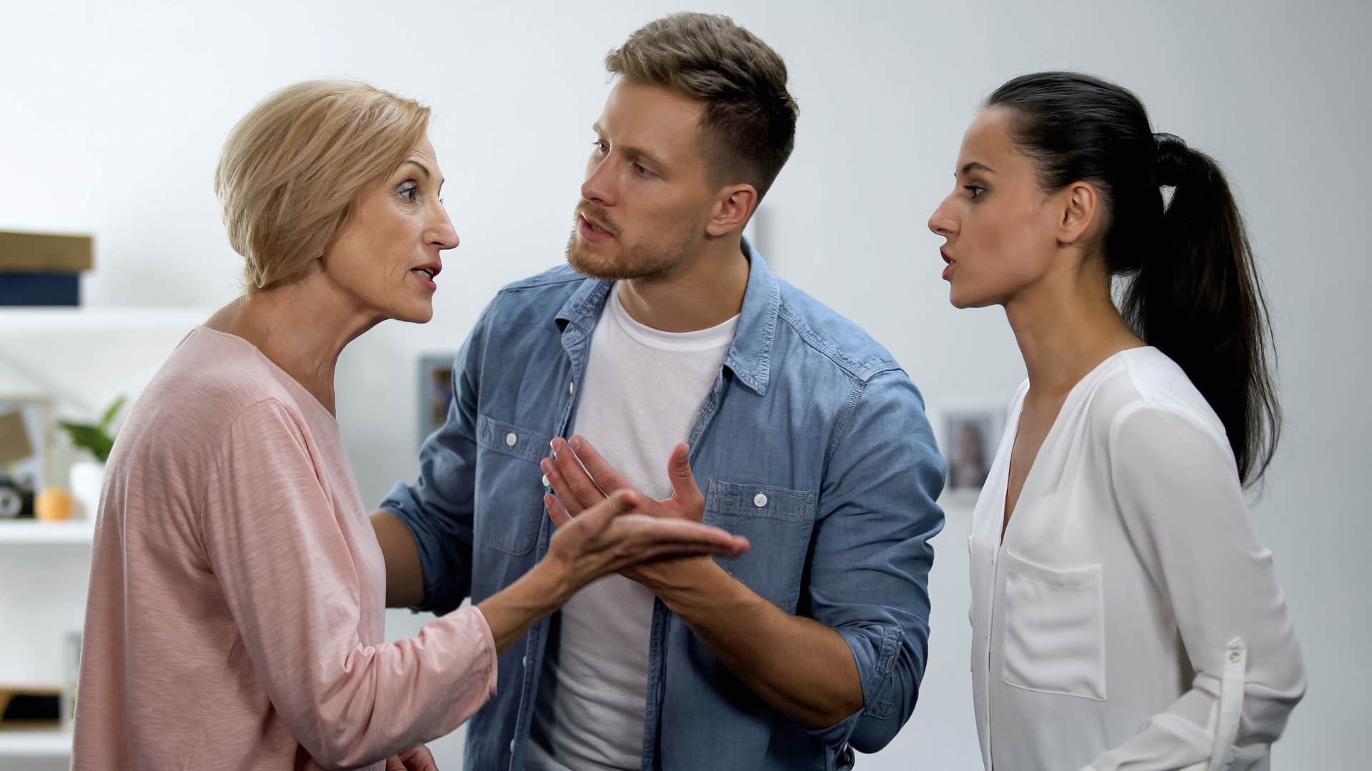 Couple arguing with an older woman