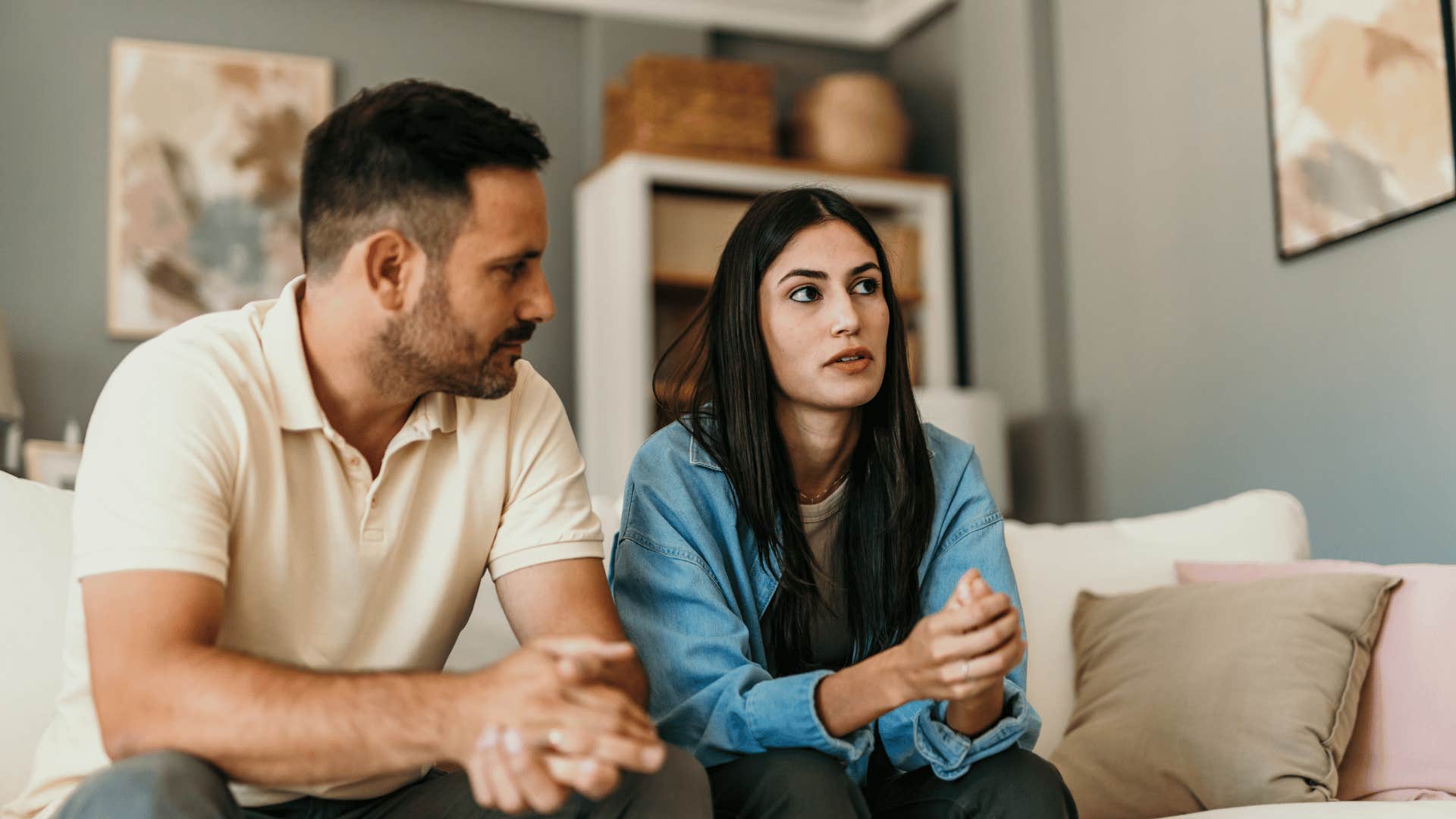 couple talking on couch