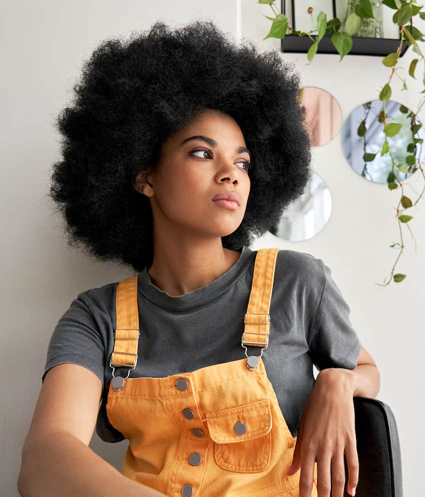 Woman sits and wonder what to do instead of fighting