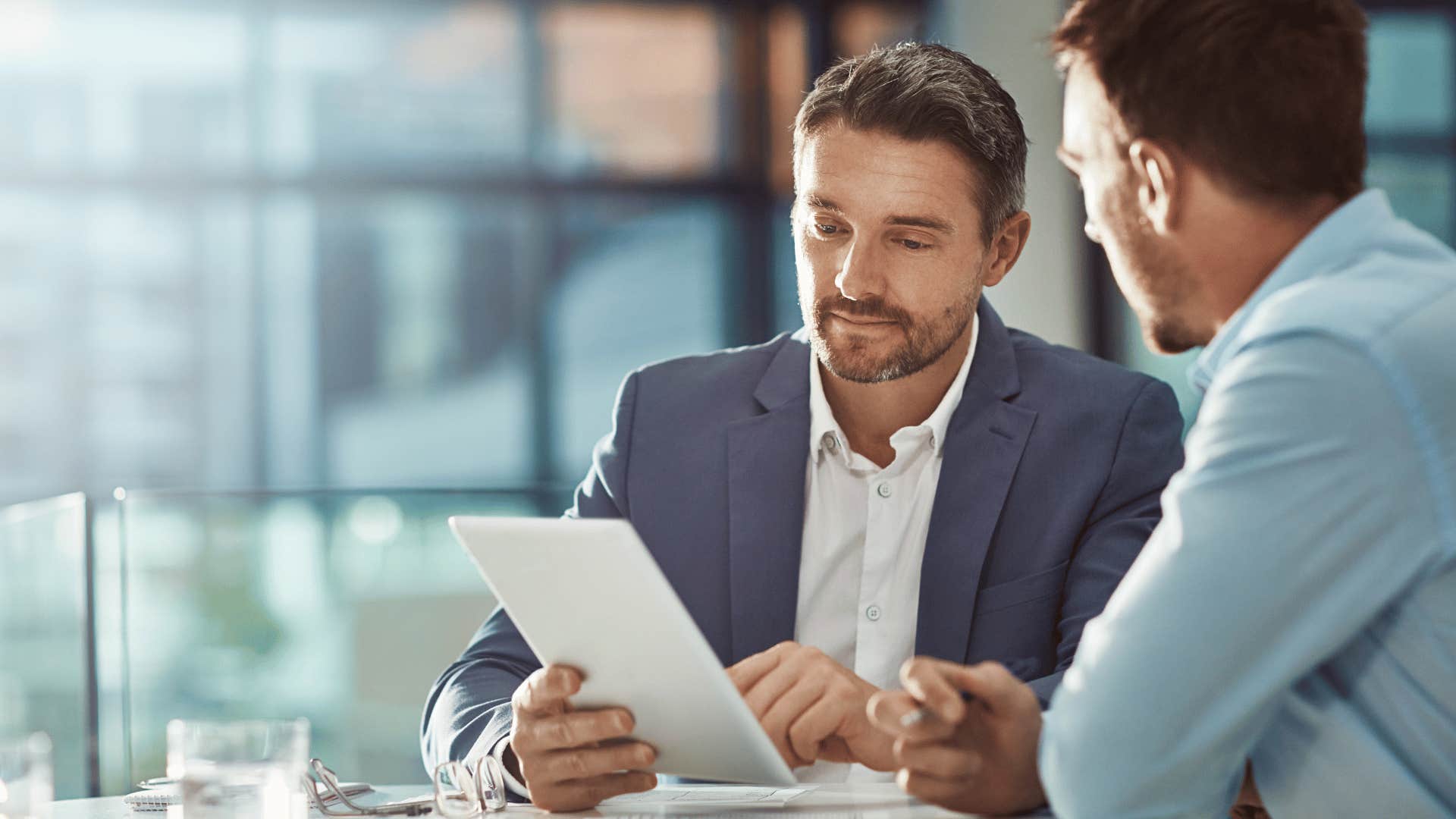 man listening during a meeting