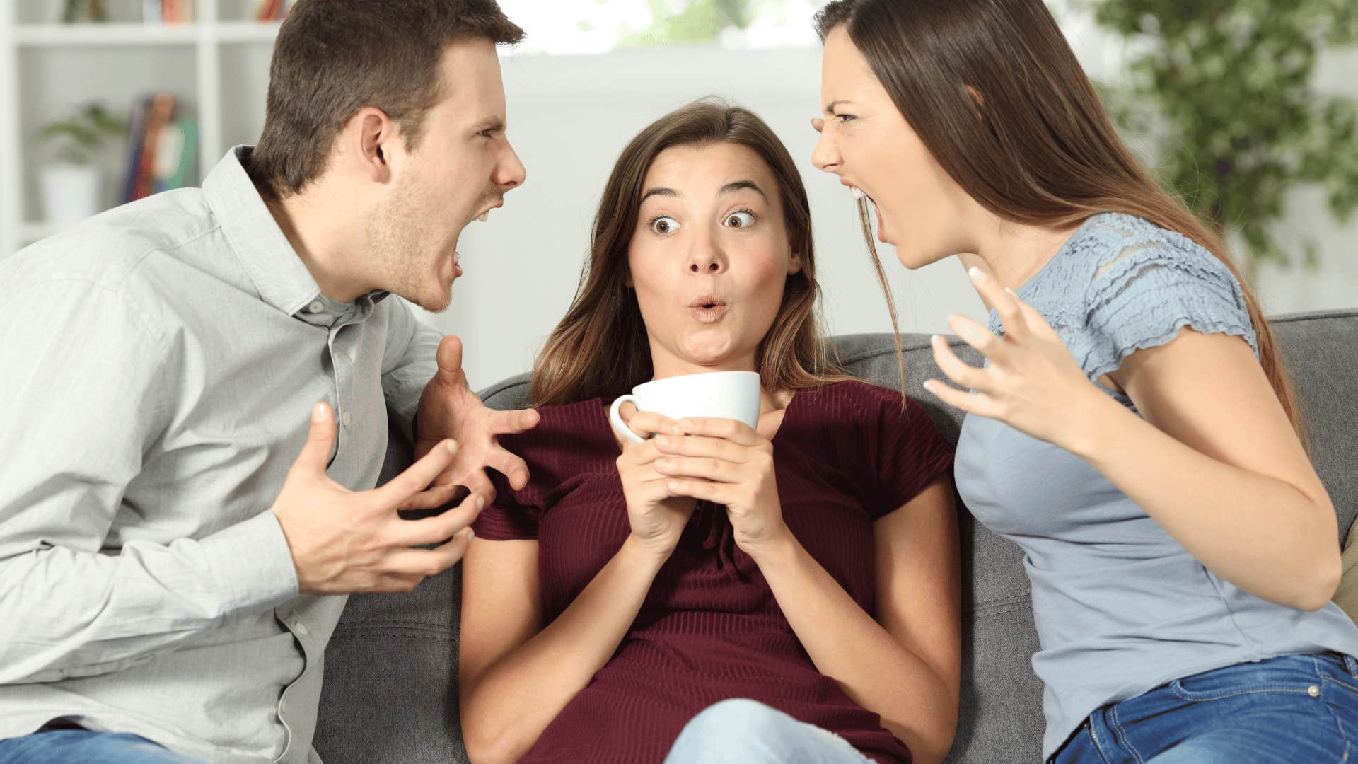 couple fighting with woman in middle