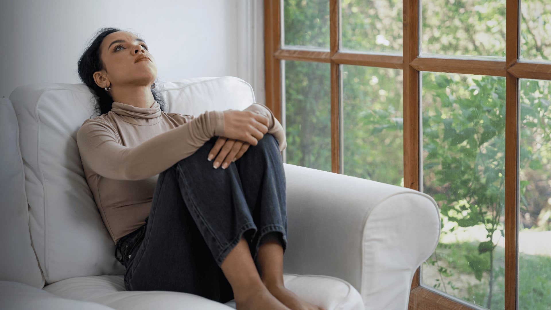 sad woman sitting in chair