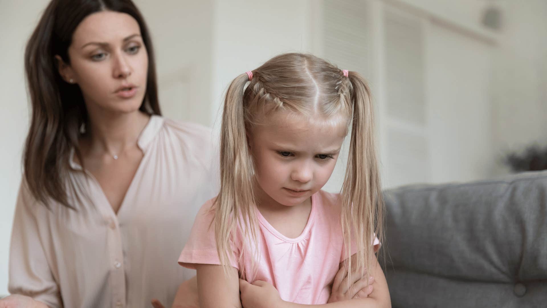 parent holding her upset child to high standards