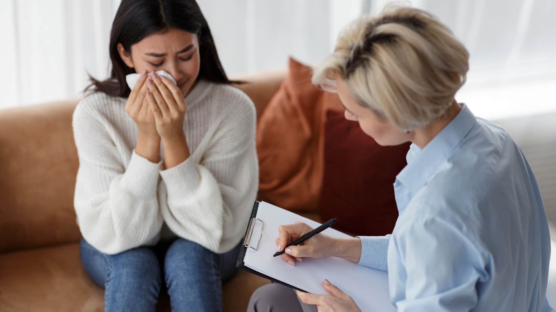 woman crying in therapy session