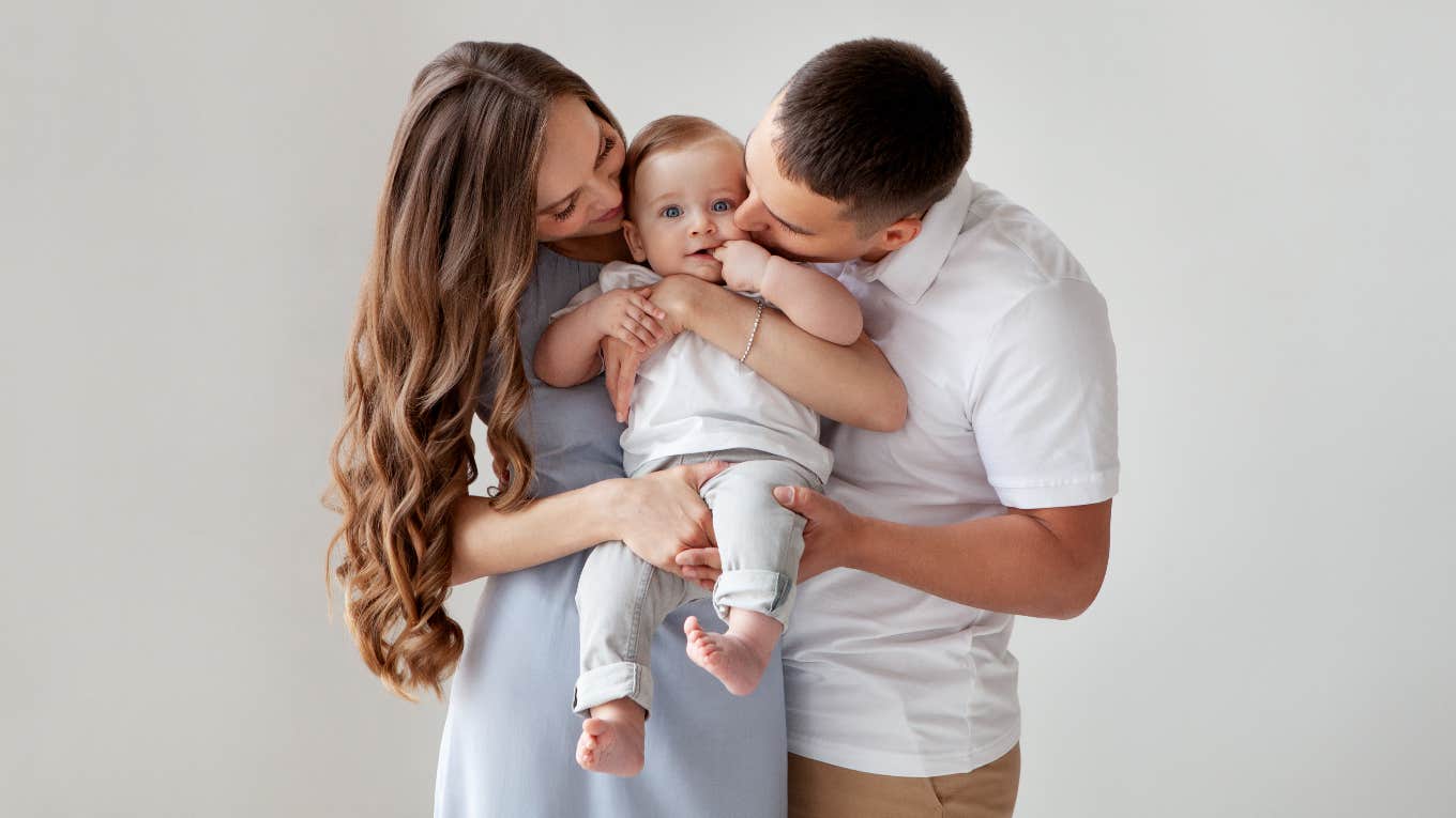 Parents holding baby