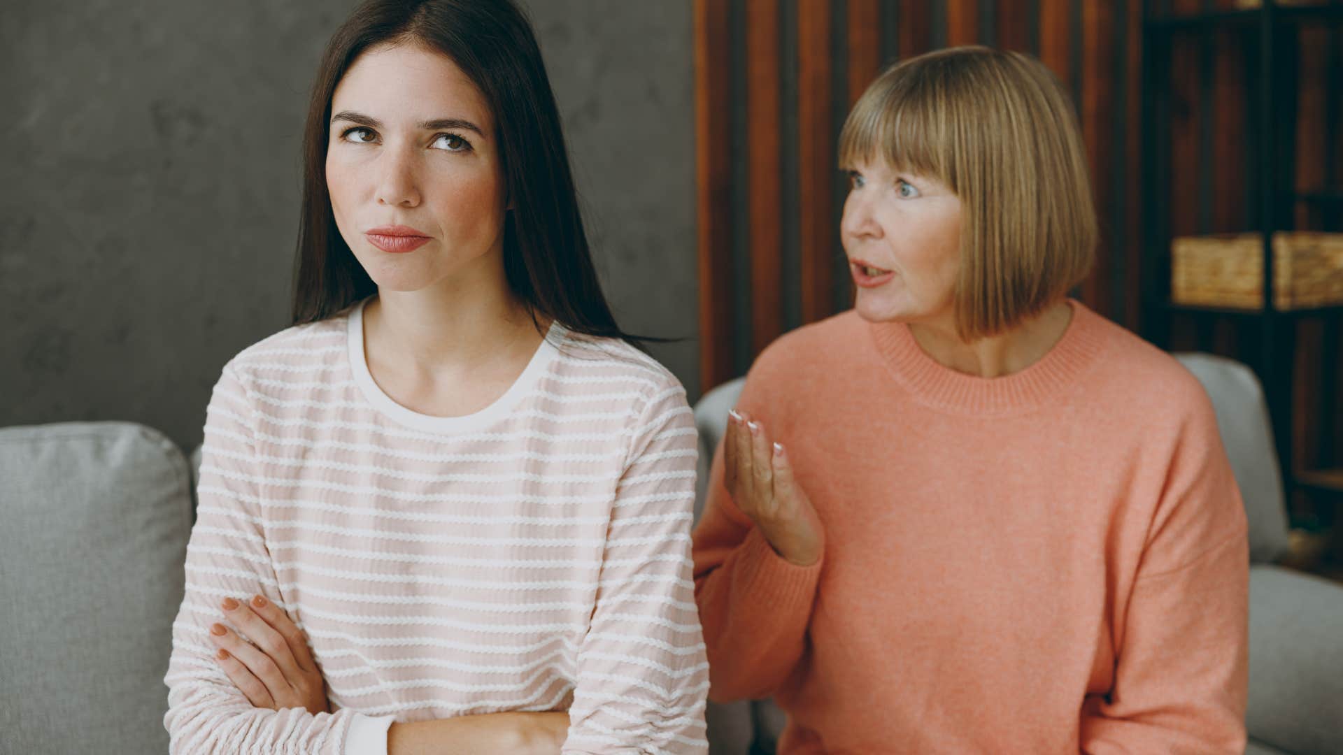 Woman turned away from her upset mother.