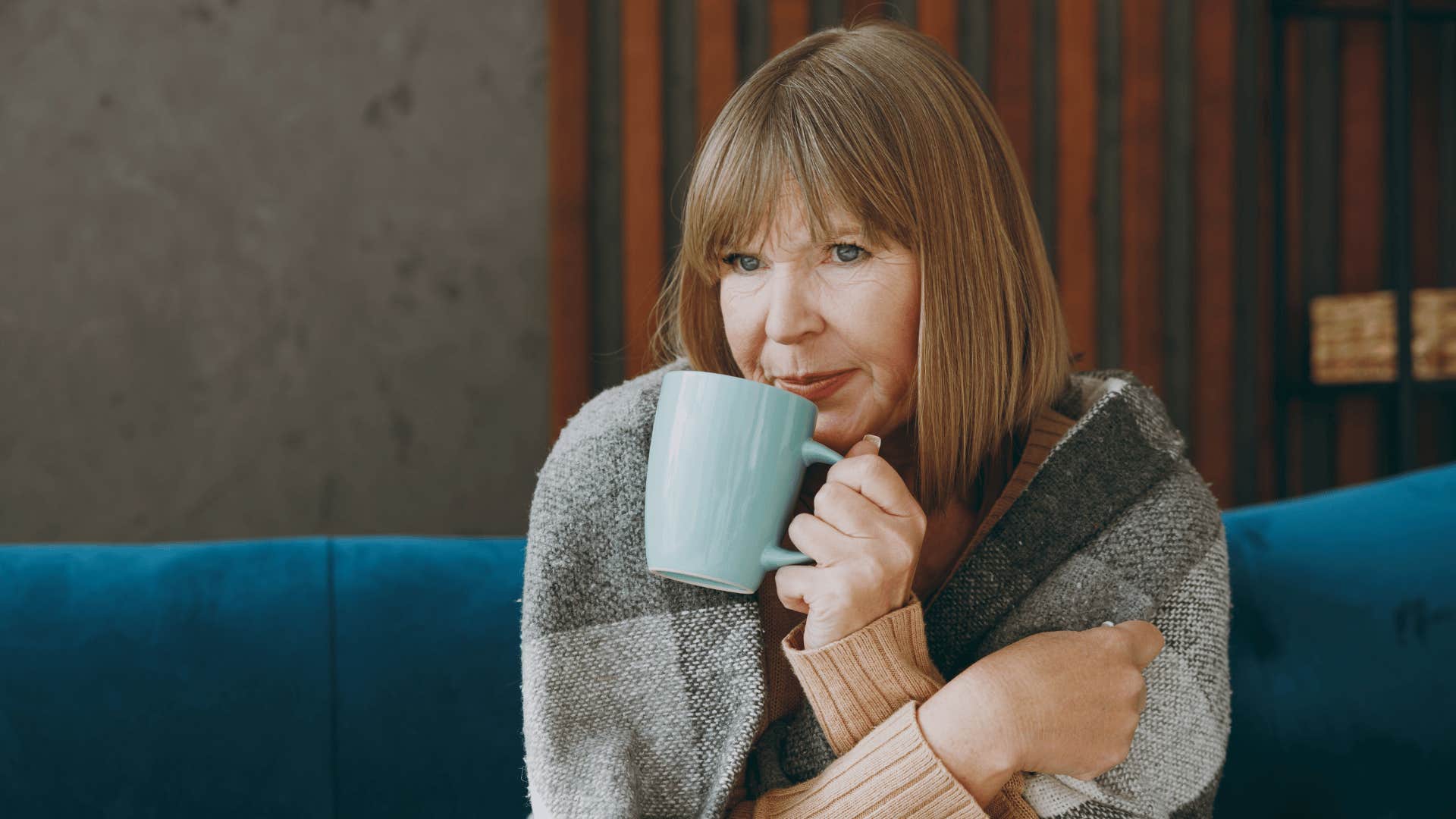 Woman sips tea to let go and relax