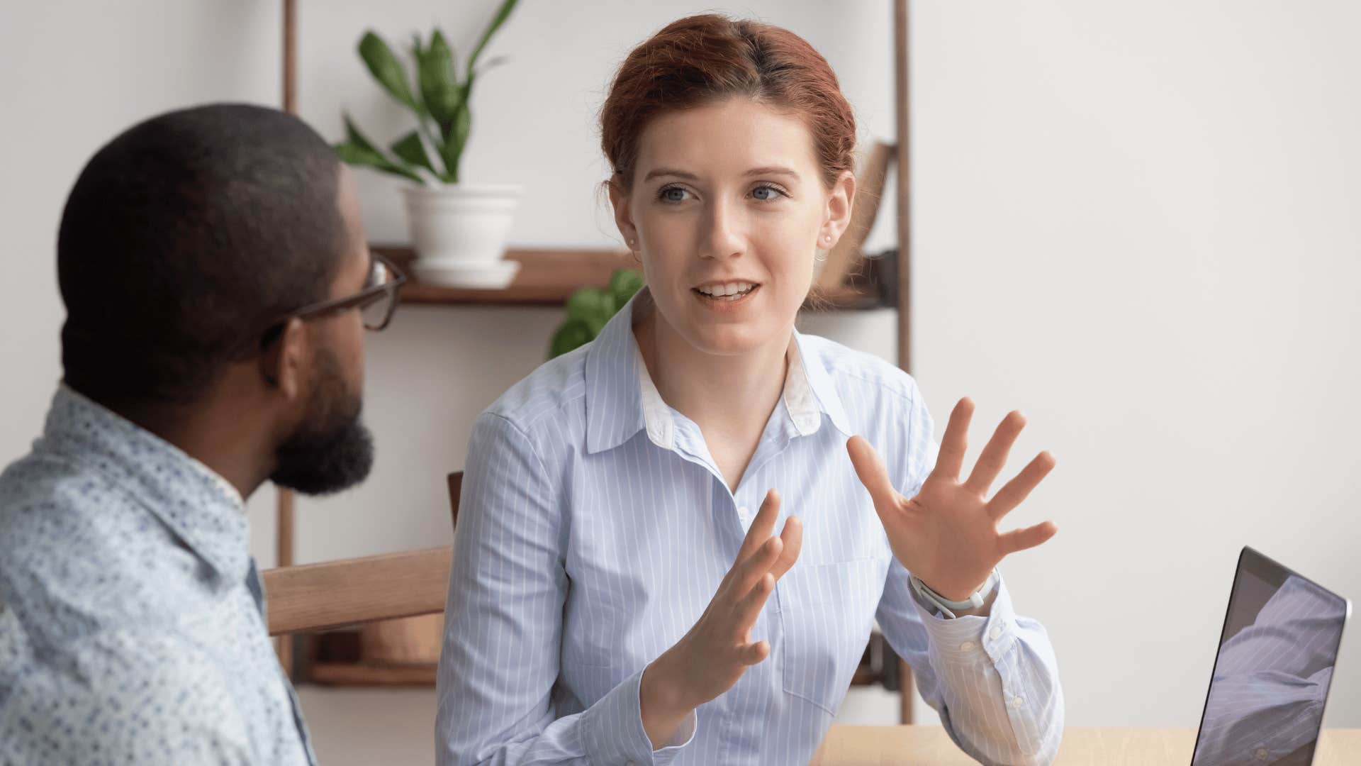 woman talking to coworker 