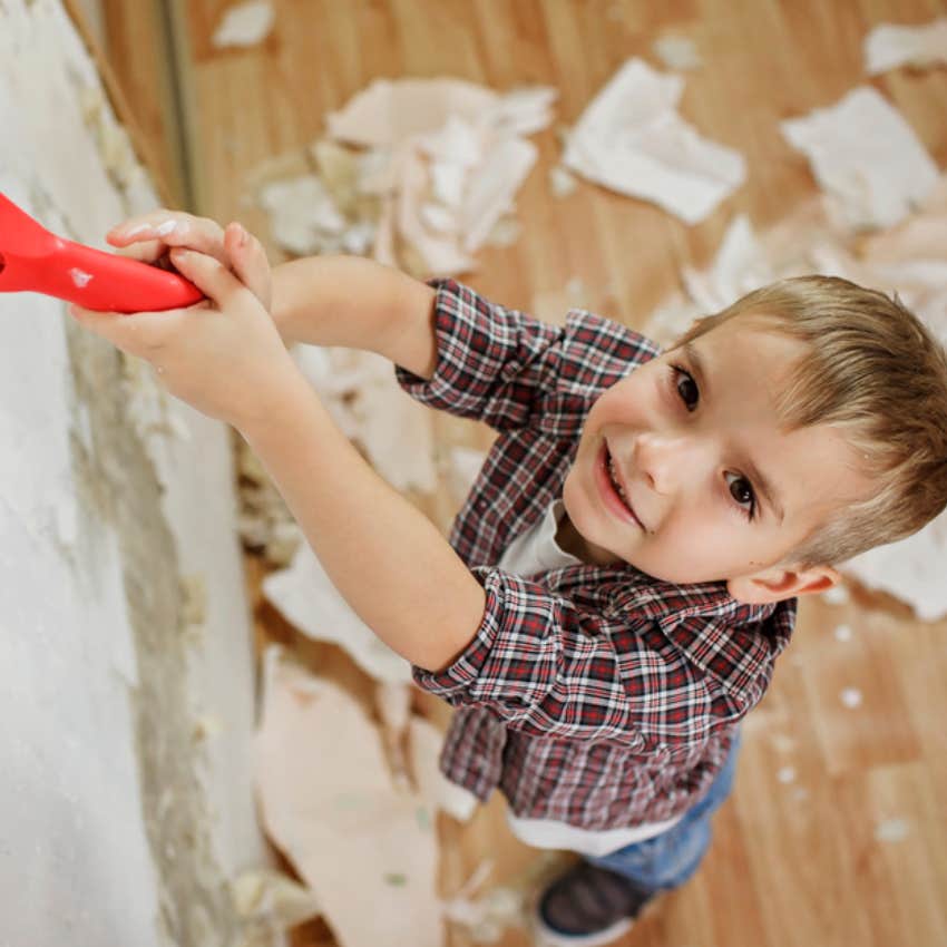 little boy helping rebuild house 