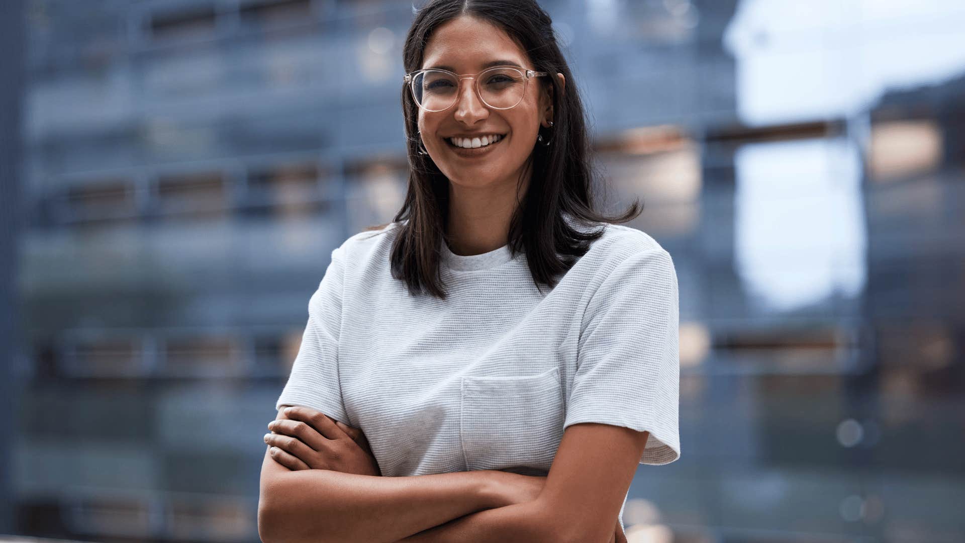 smiling woman with her arms crossed