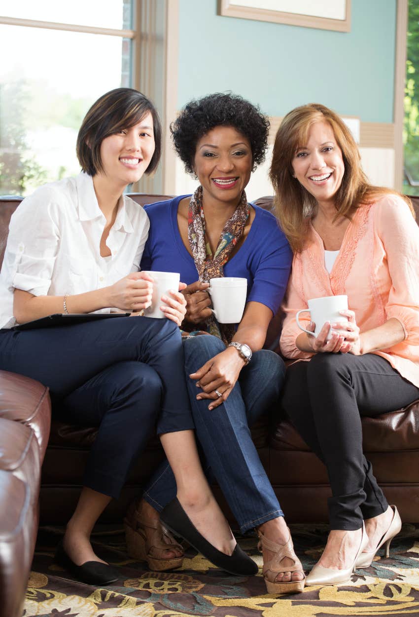 three female friends having coffee 