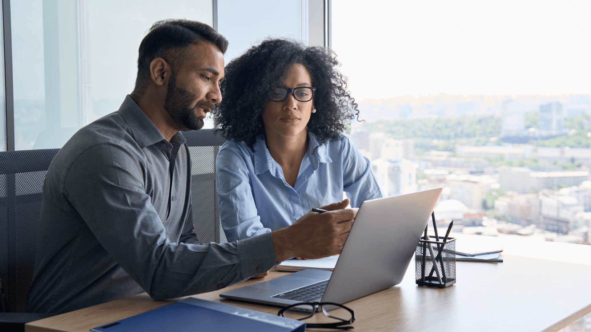 man and woman working together 