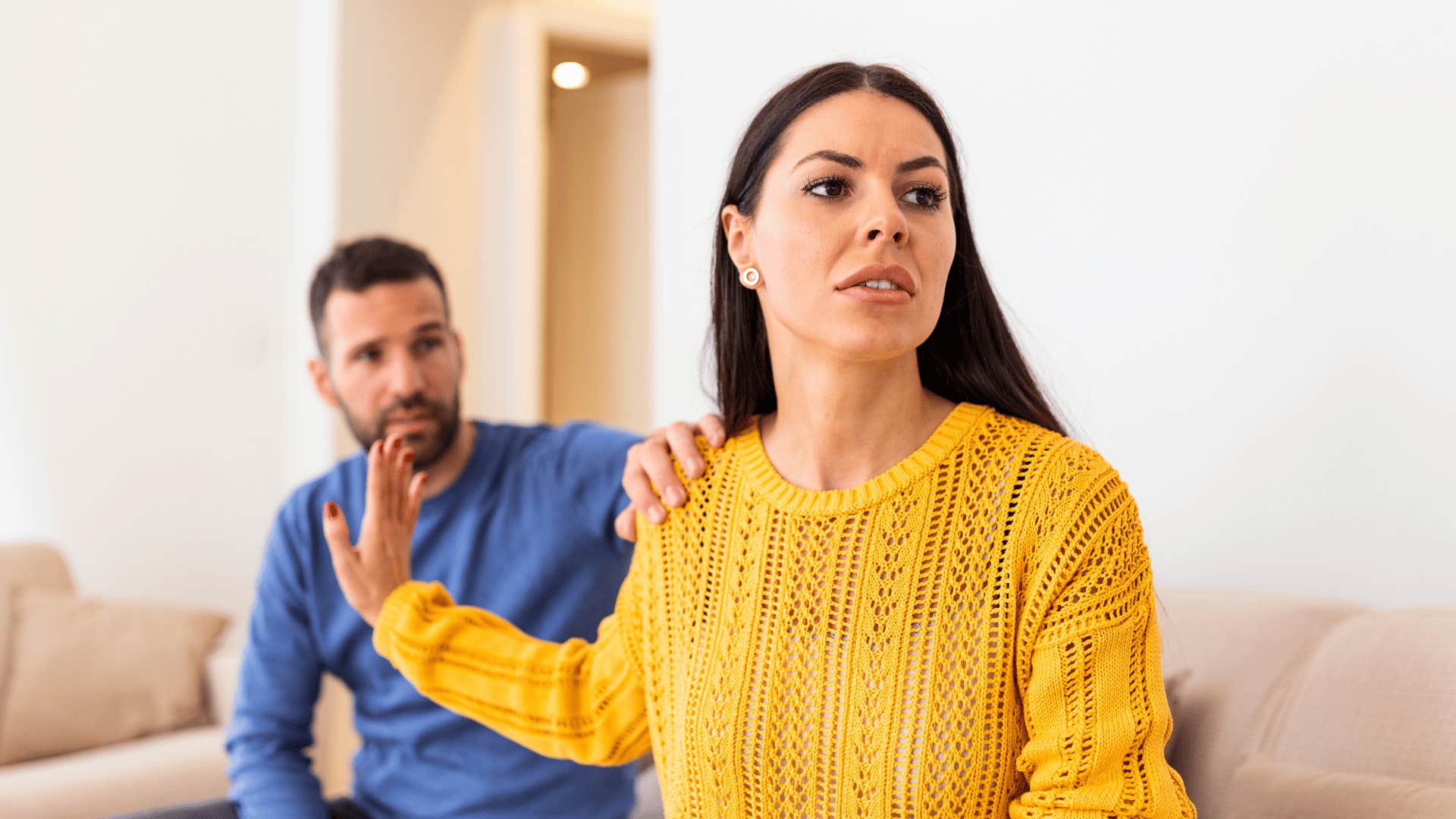 woman pushing man away