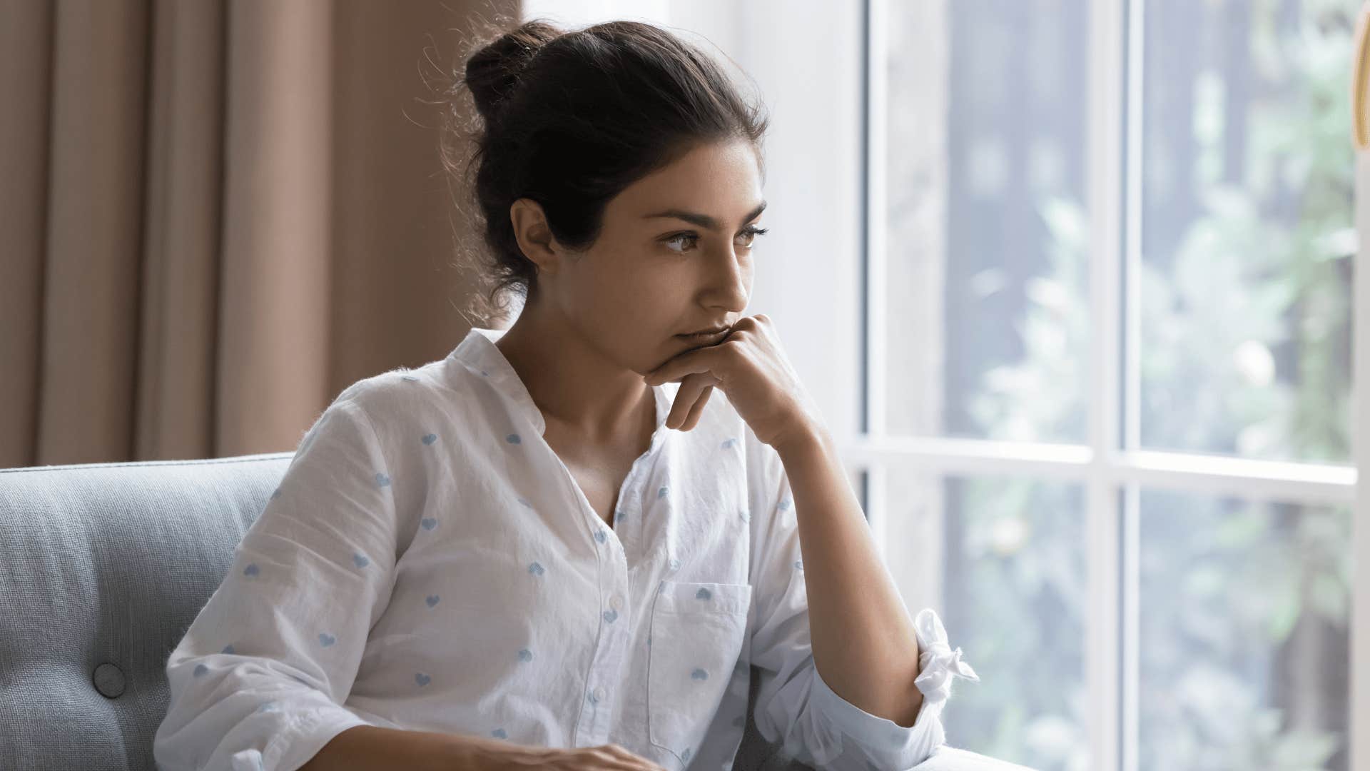 woman thinking by the window