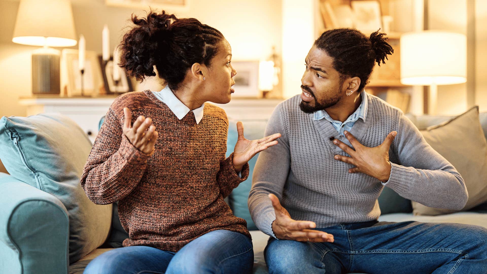 couple arguing on the couch