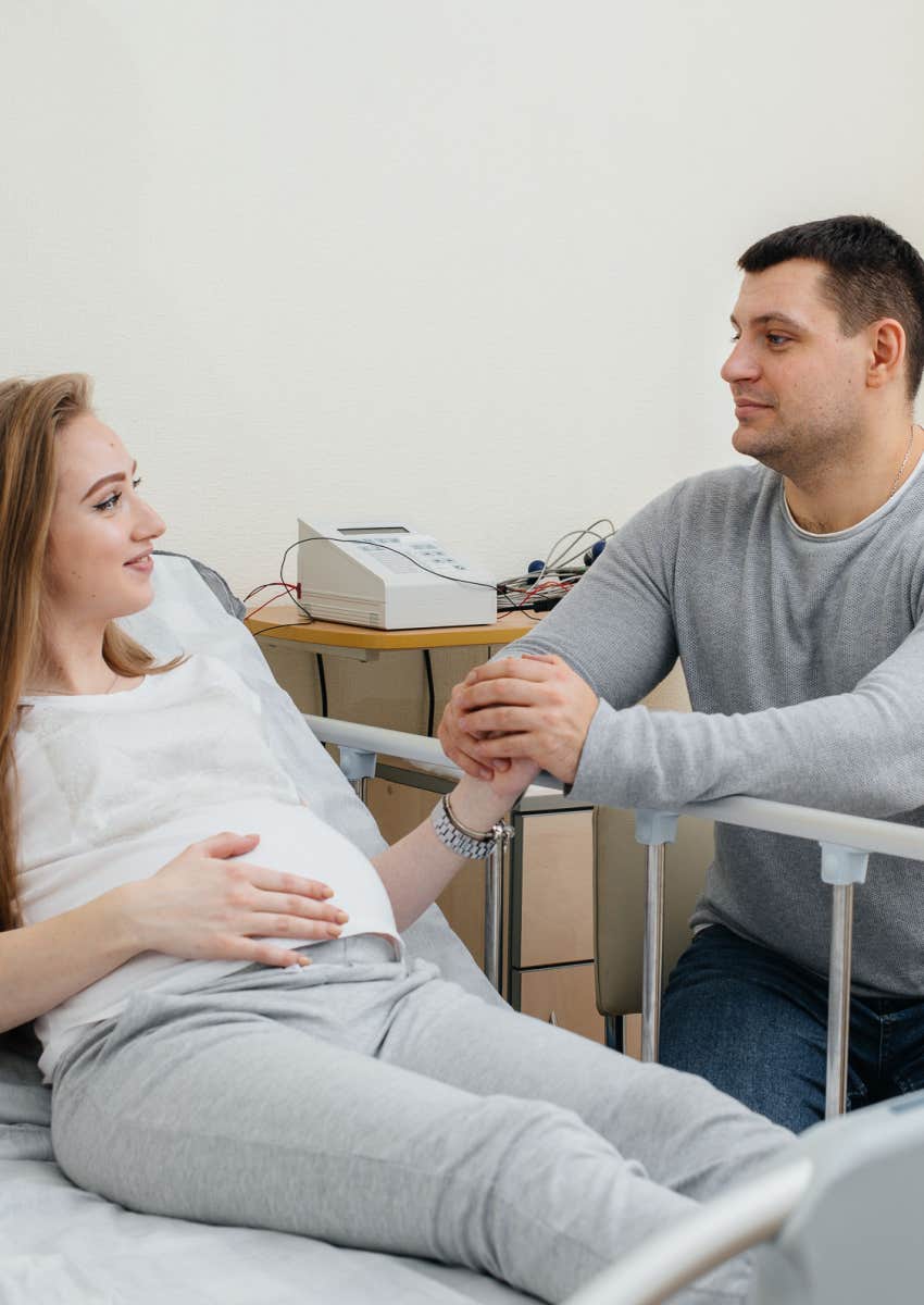 Man and pregnant wife in hospital