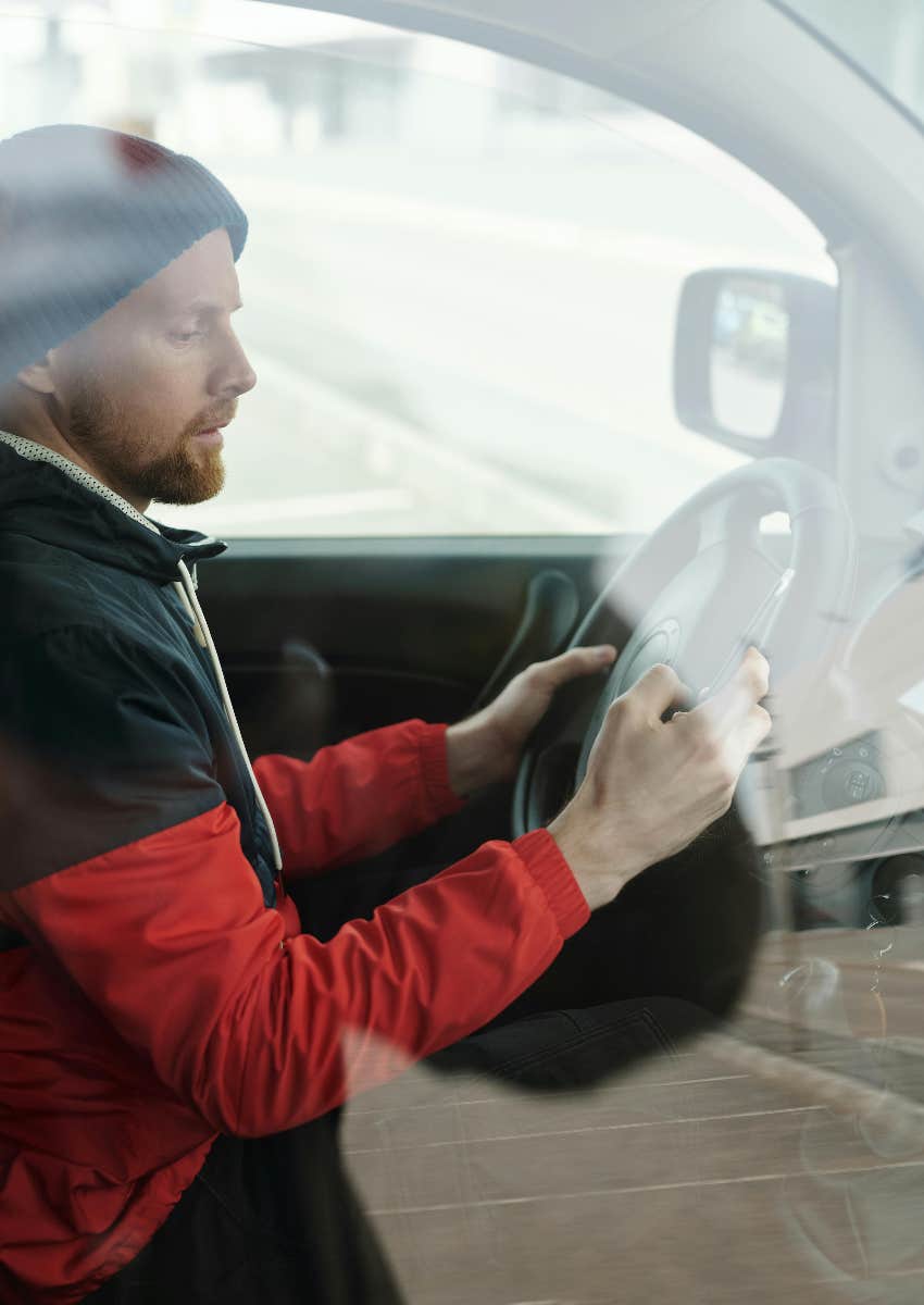 man in car