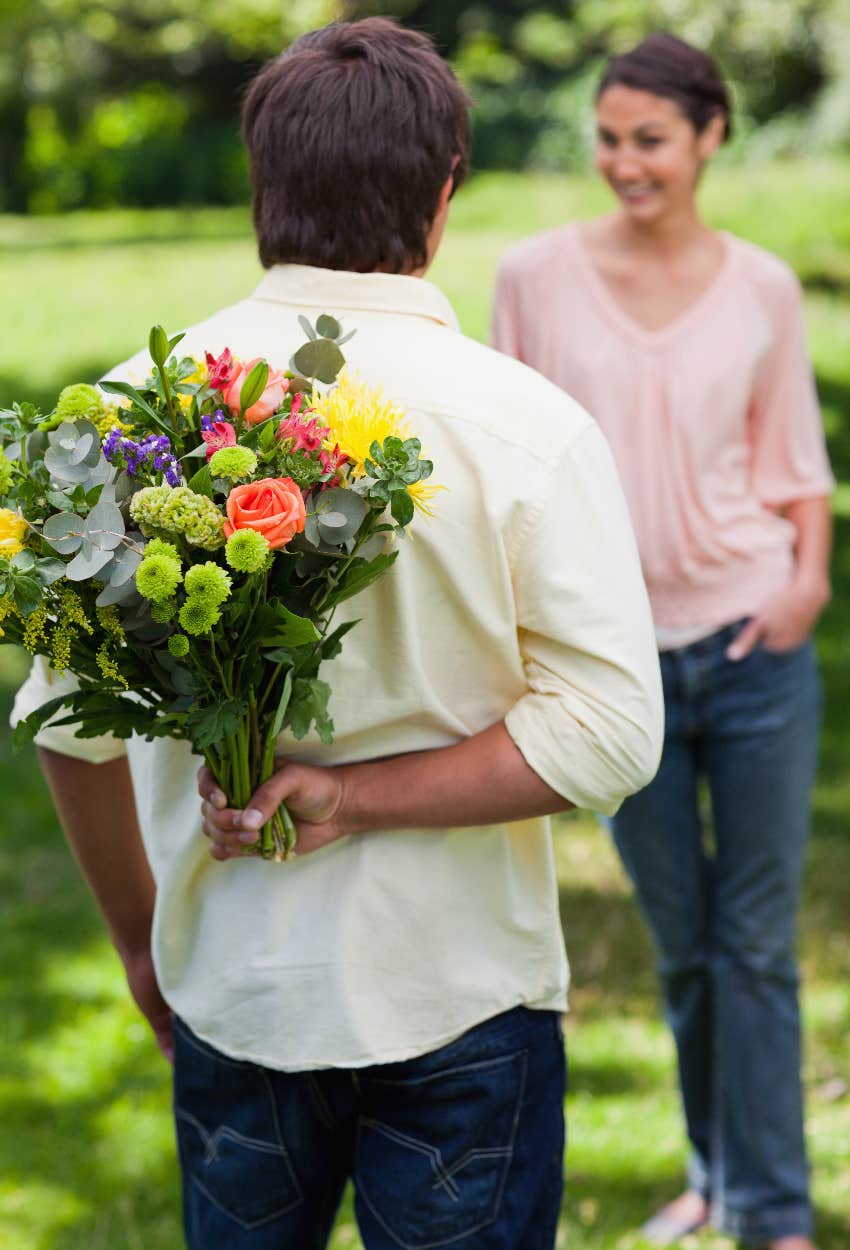 Man giving his girlfriend flowers