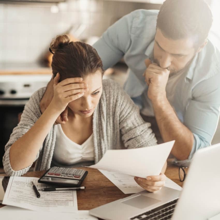 man and wife struggling to pay bills 