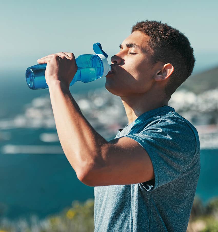 Man drinks water, new habit for January to manifest best year