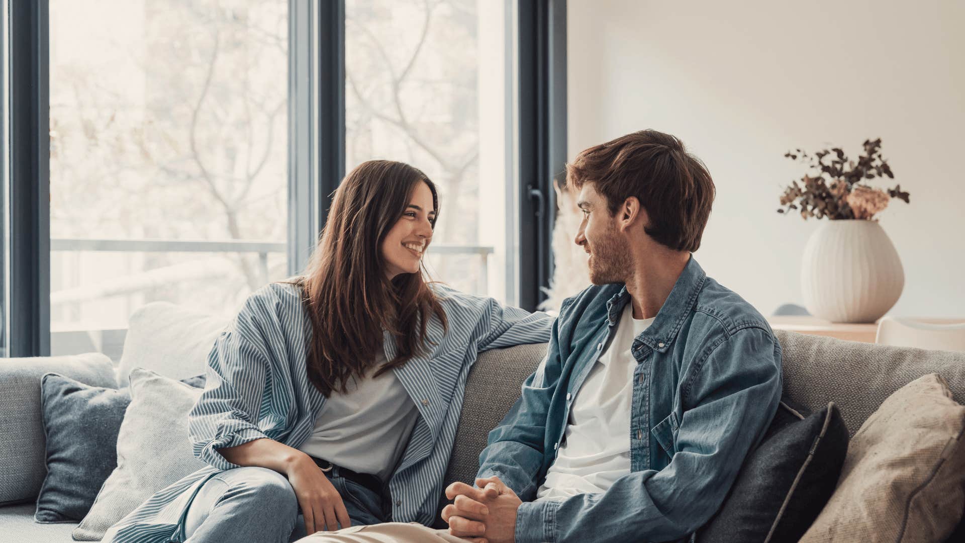 couple talking on couch