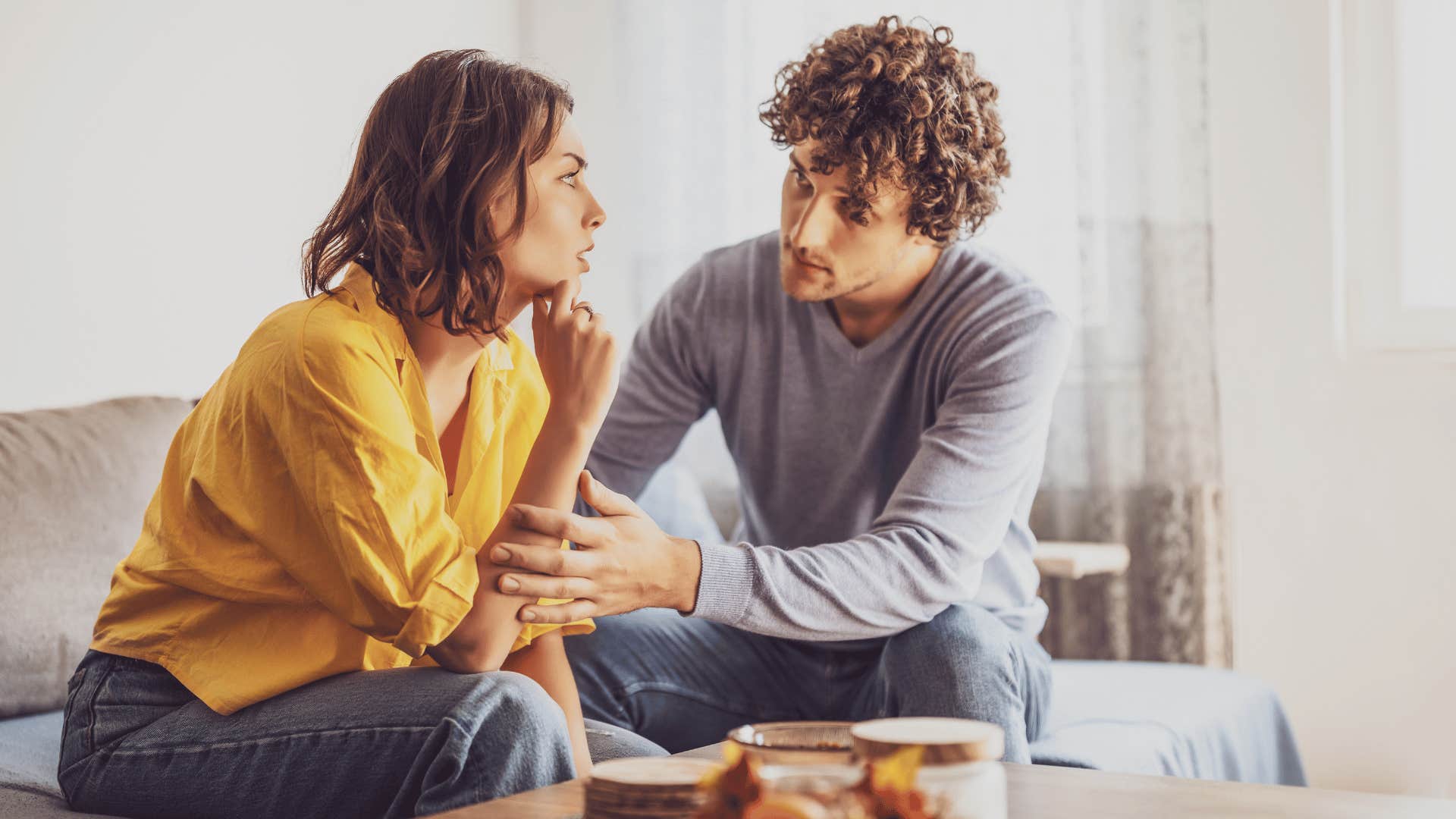 couple talking on couch