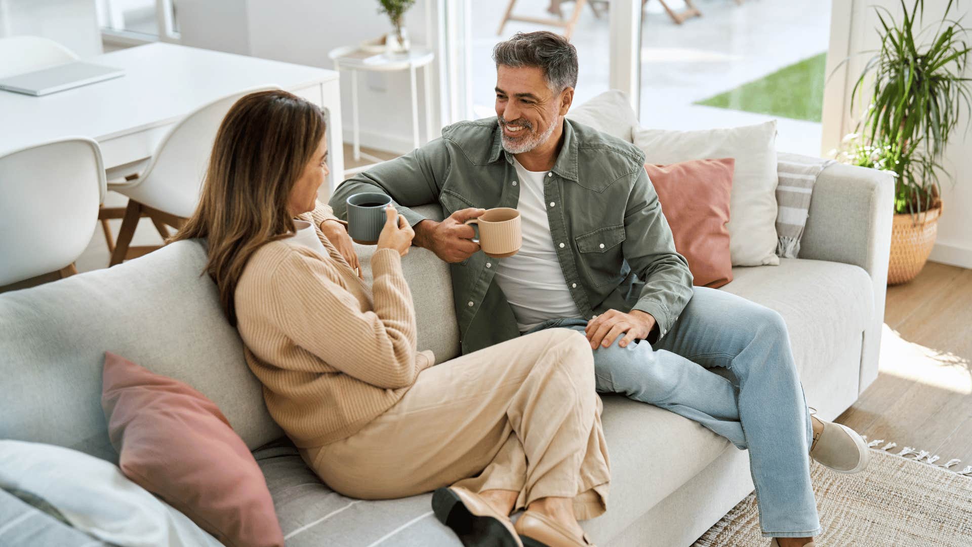 couple drinking coffee on couch