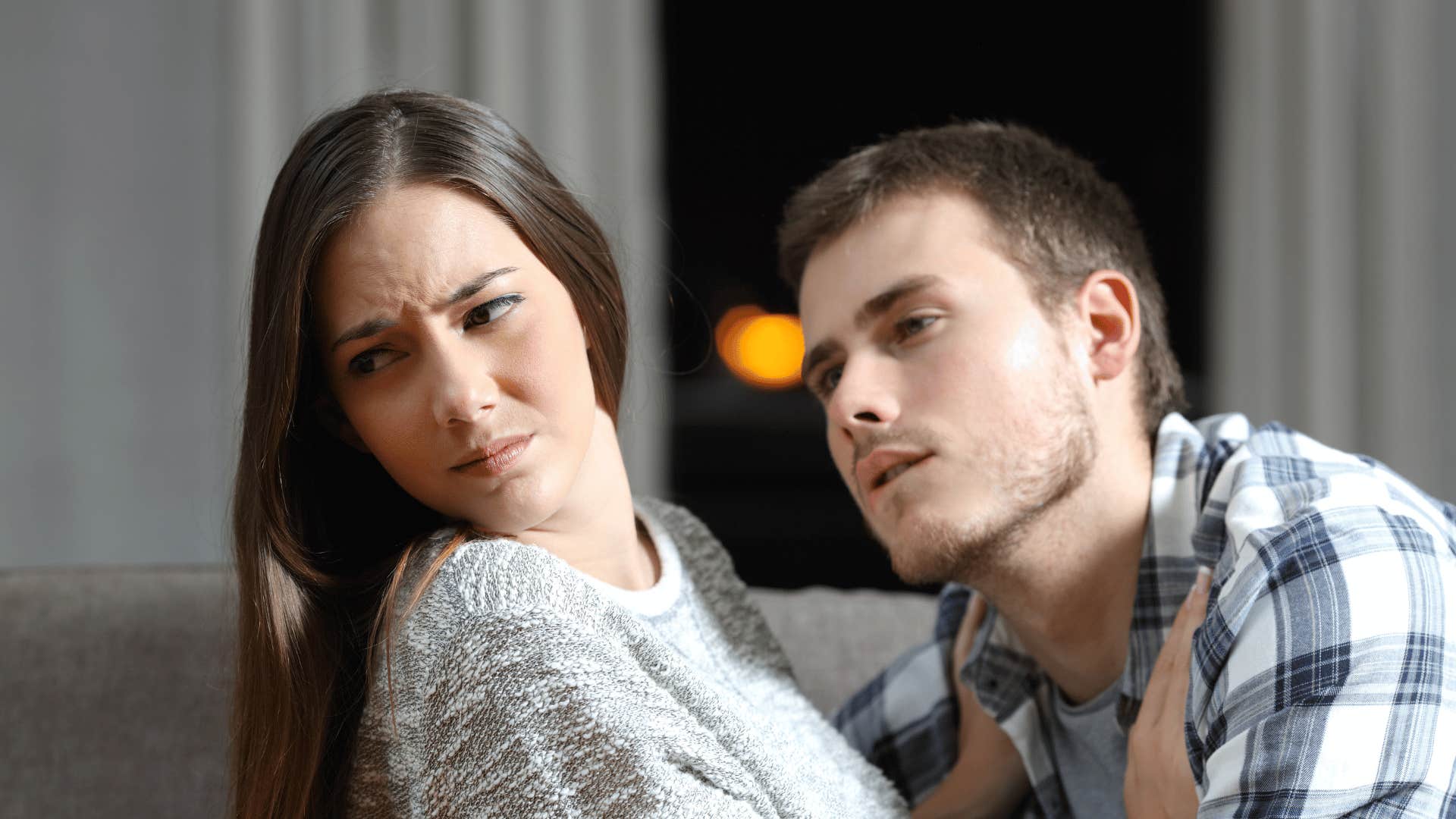 woman turning head away from man