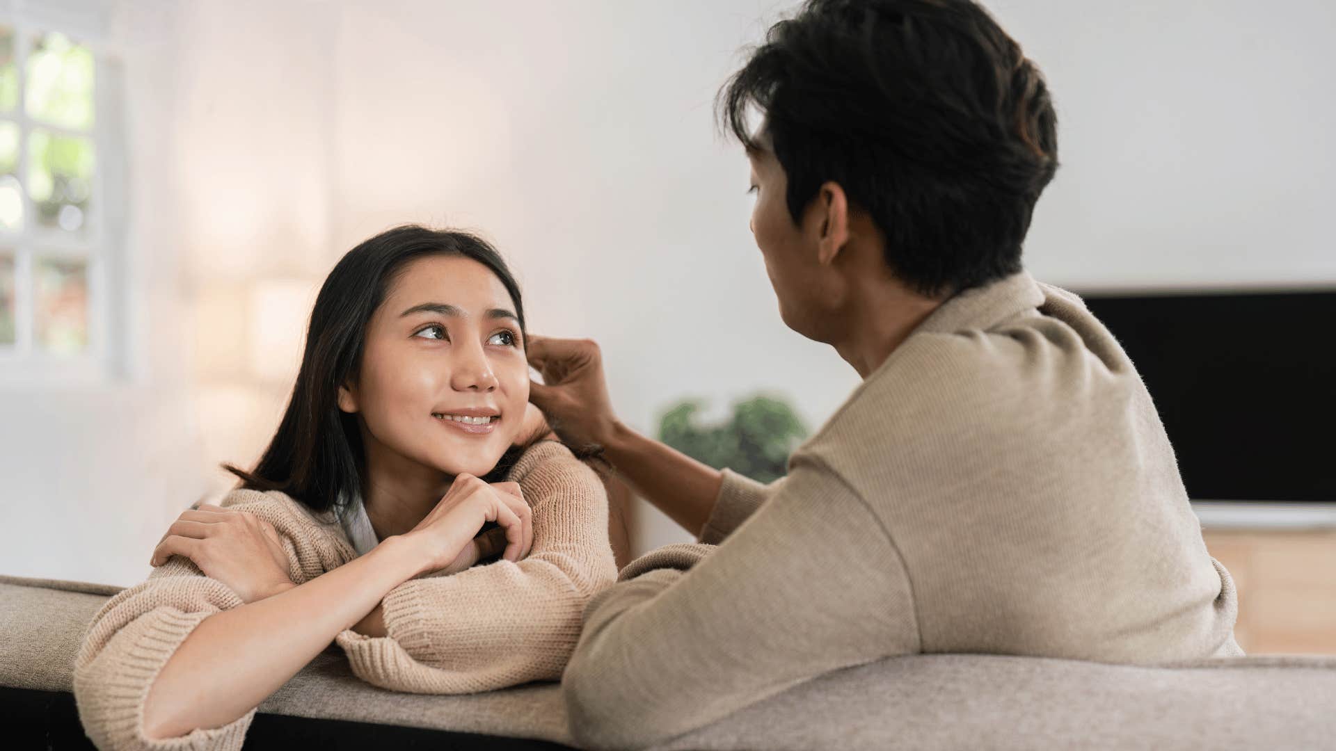 couple talking on couch