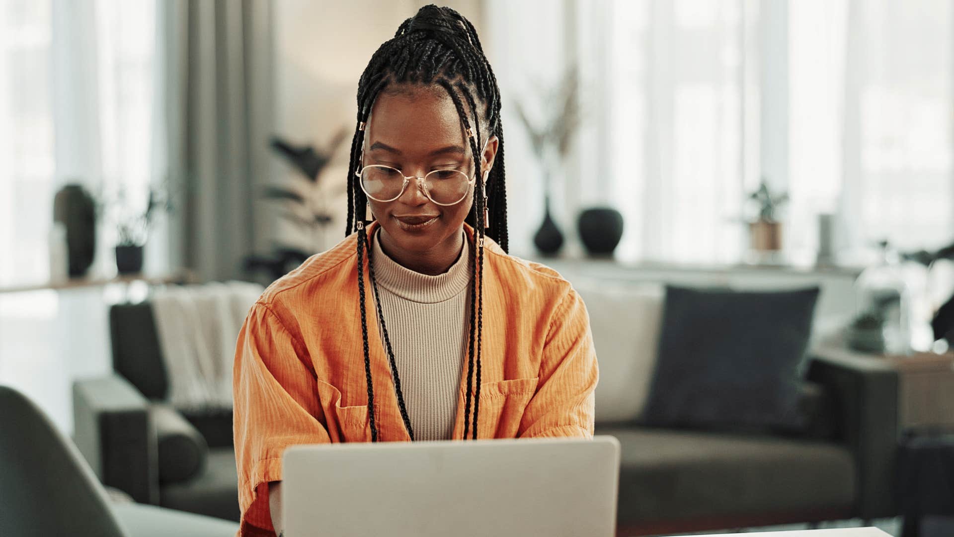 woman typing on laptop