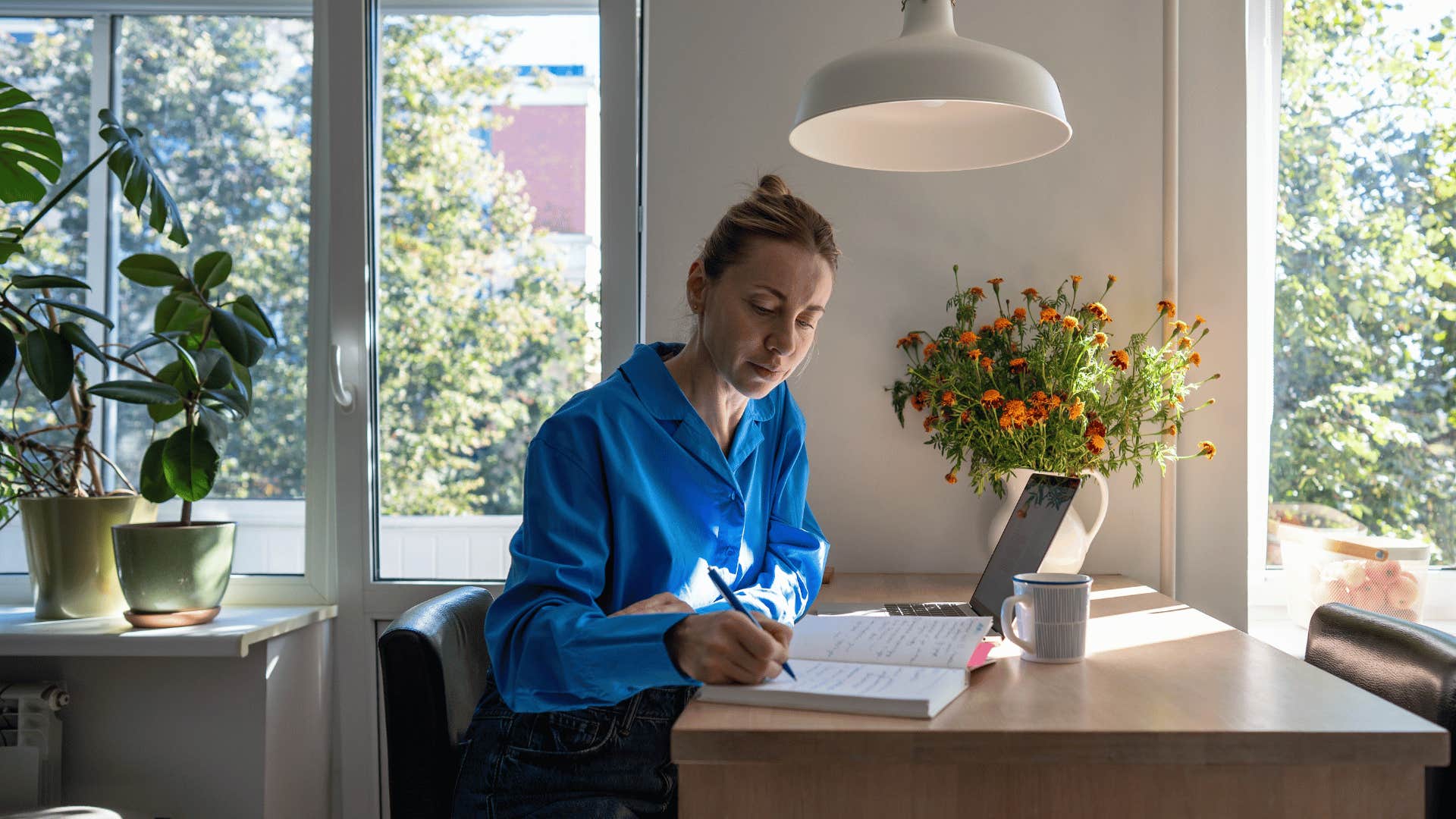 woman working at kitchen table