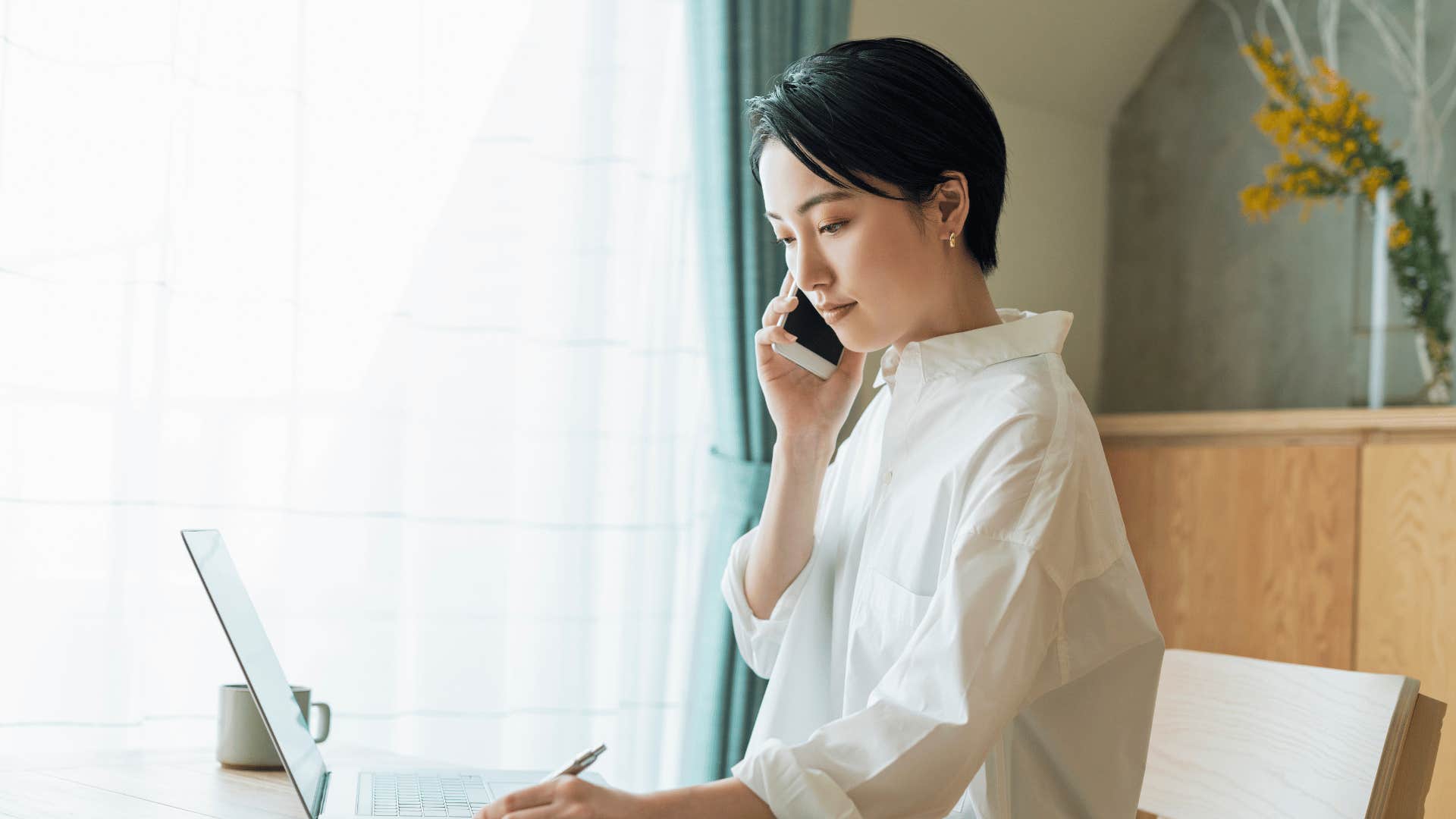 woman working and on phone