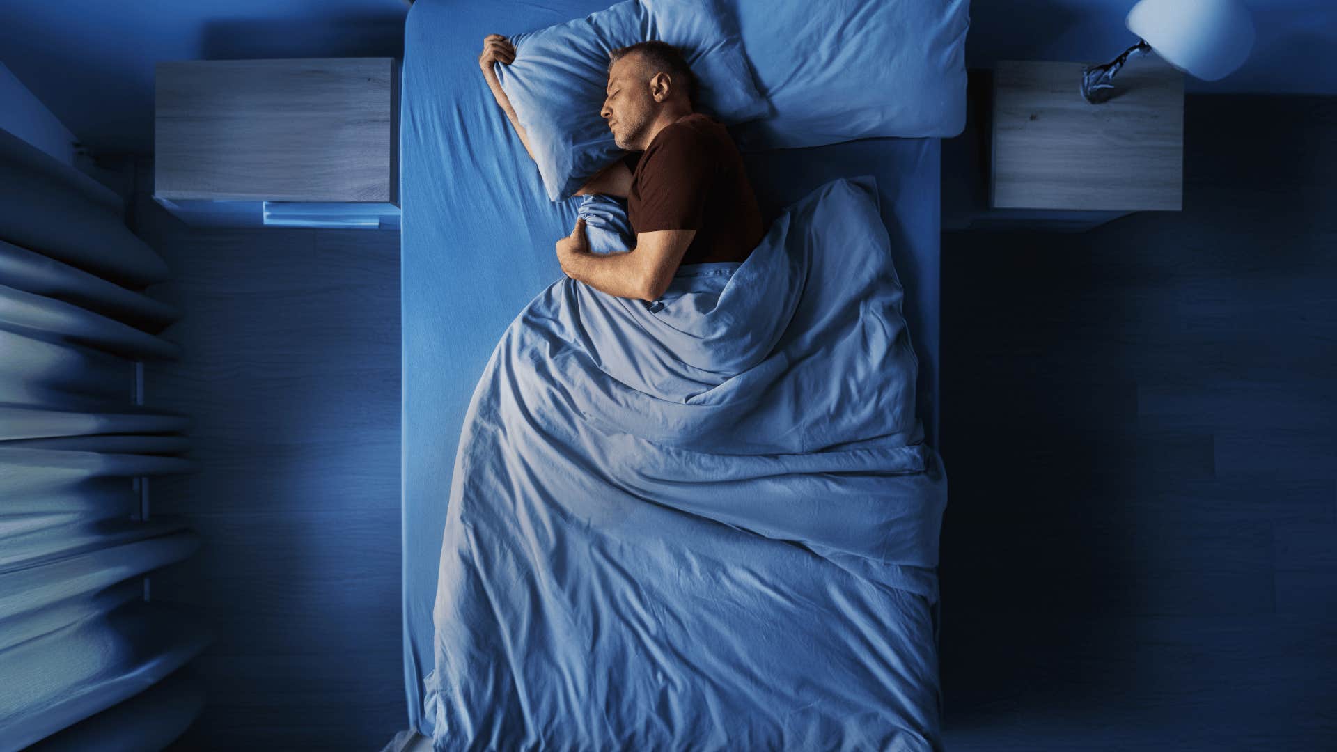 man sleeping on bed