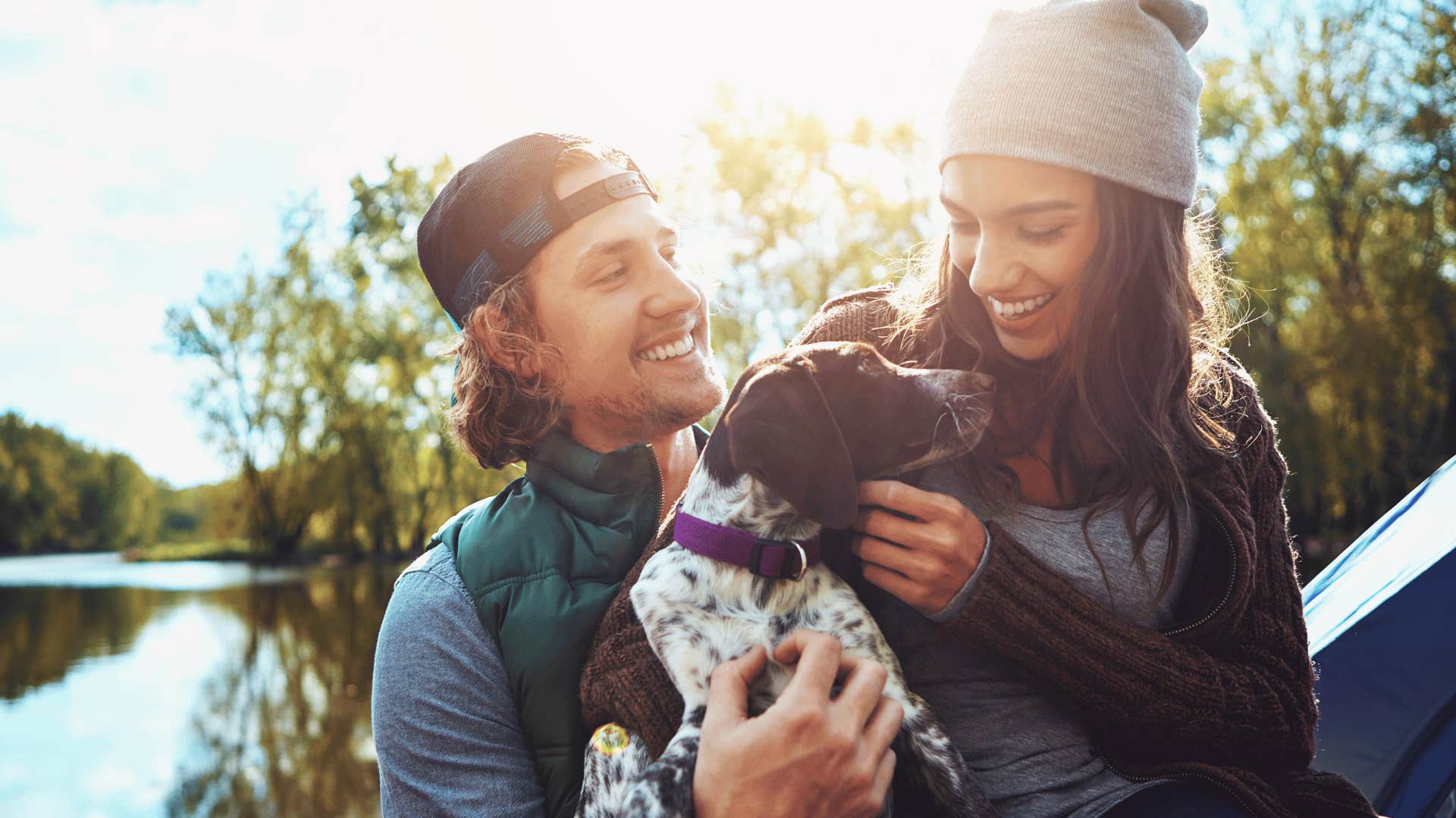 couple smiling with dog