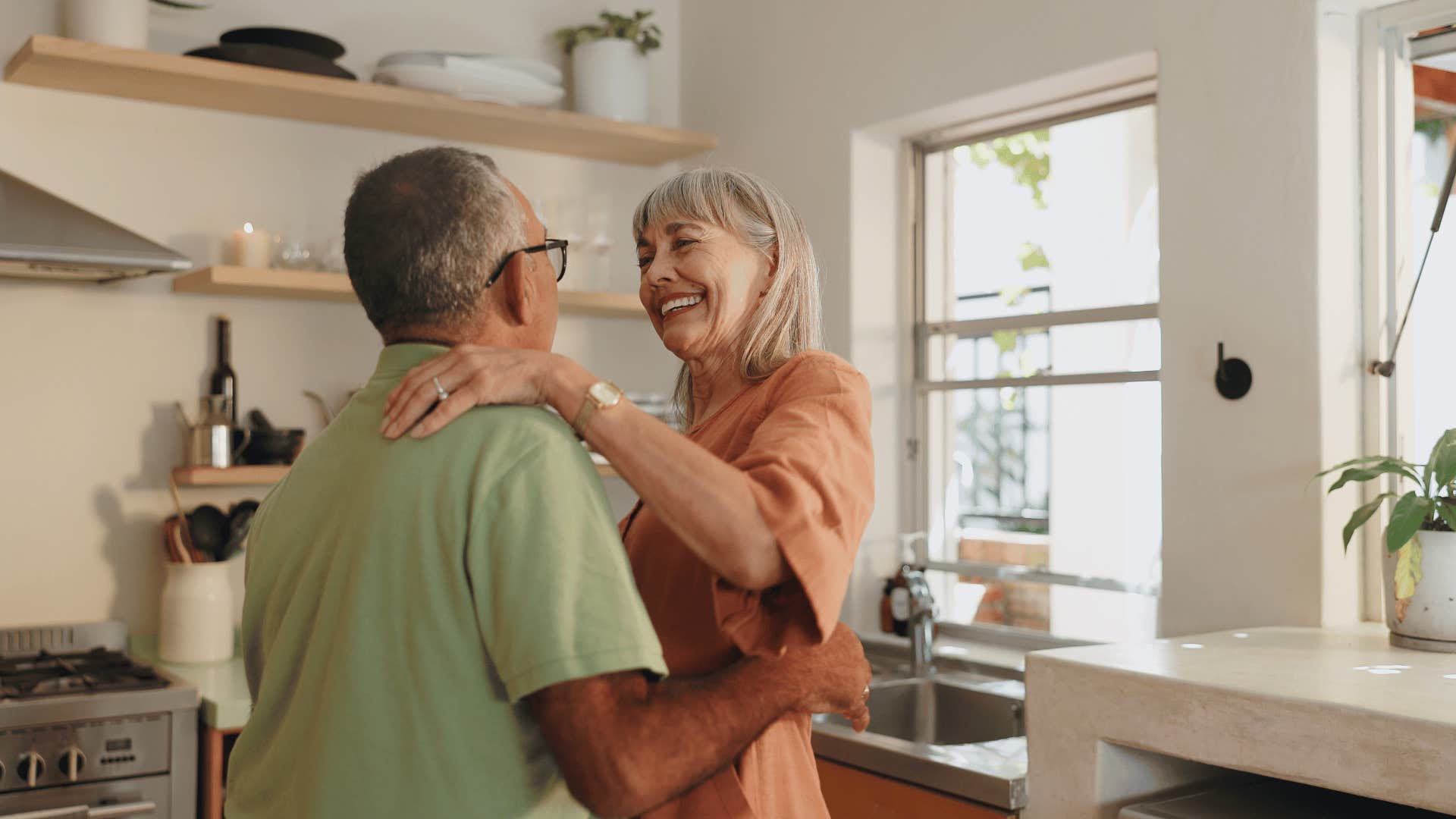 older couple dancing in kitchen