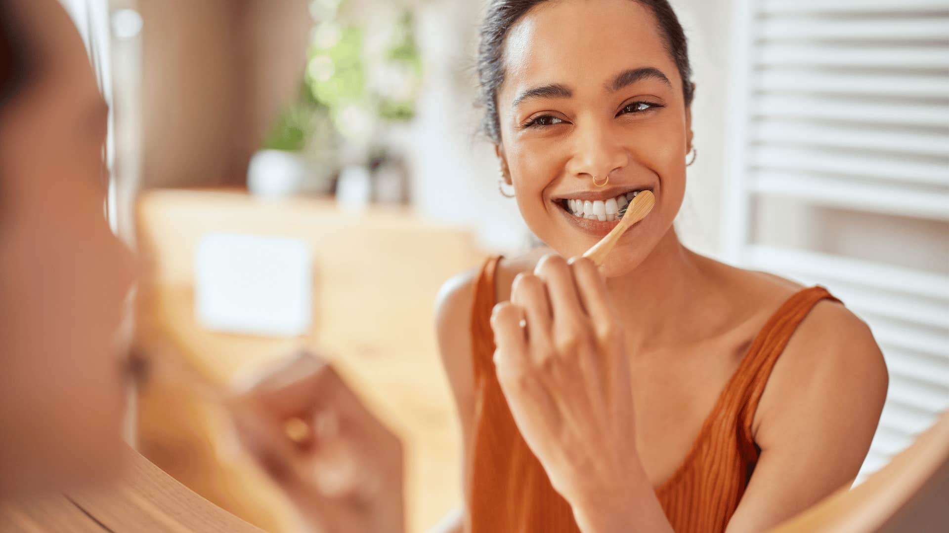 woman brushing her teeth