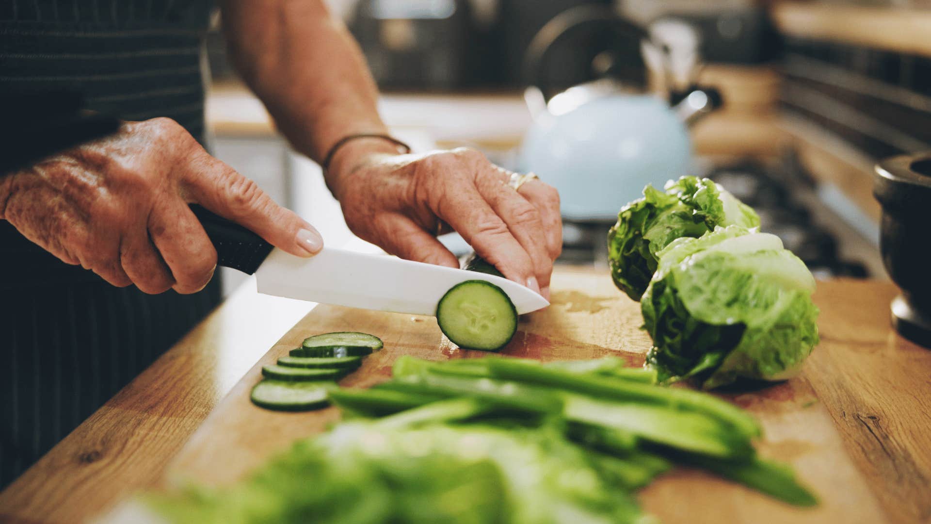 person cutting vegetables