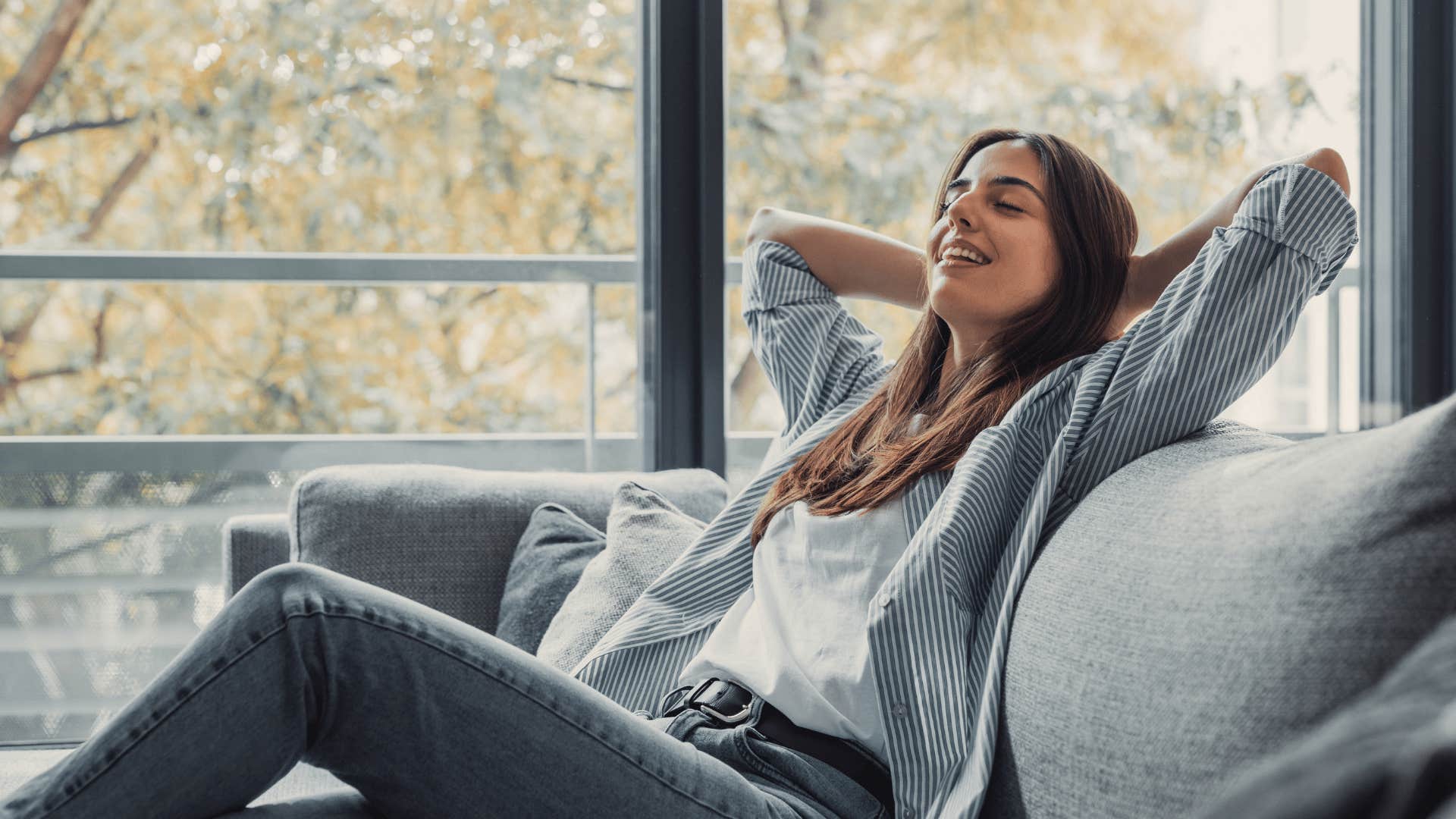 relaxed woman sitting on couch