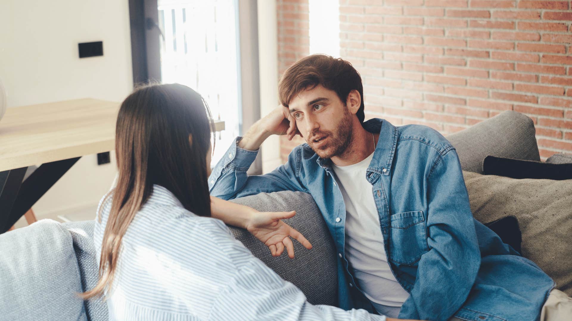 couple talking on couch