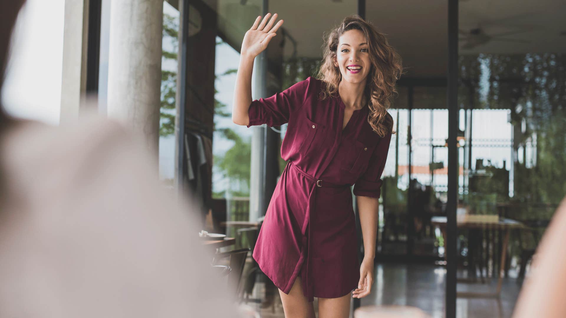 woman waving