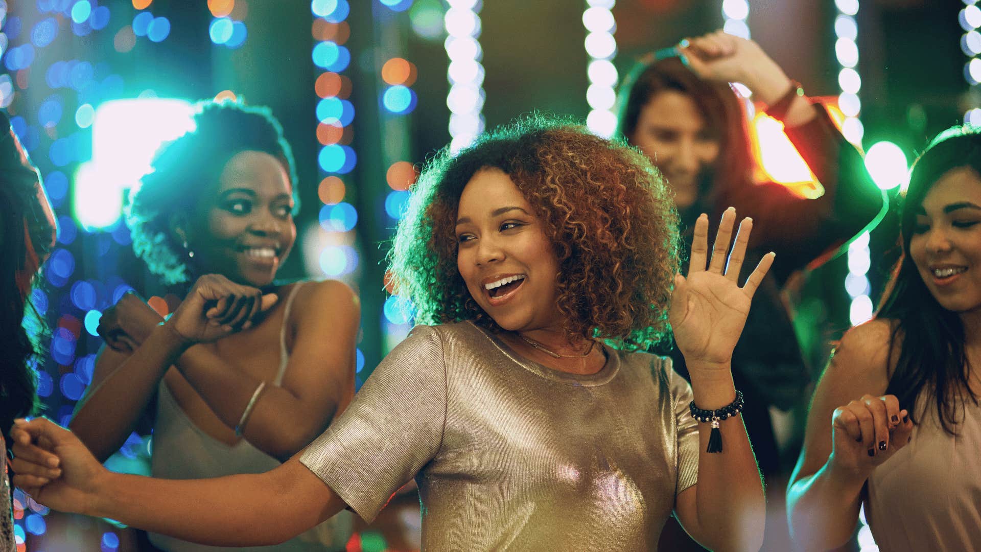 Group of dancing women who met randomly at a bar