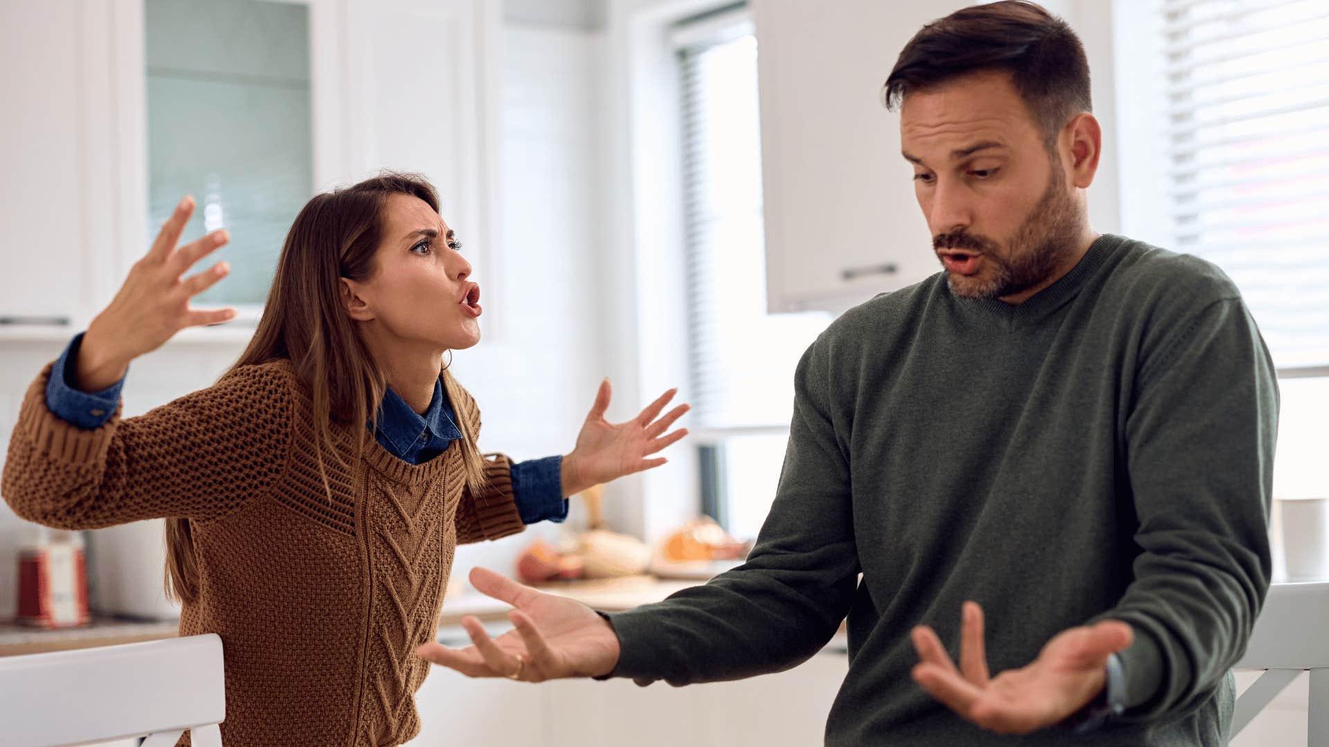 couple arguing in kitchen