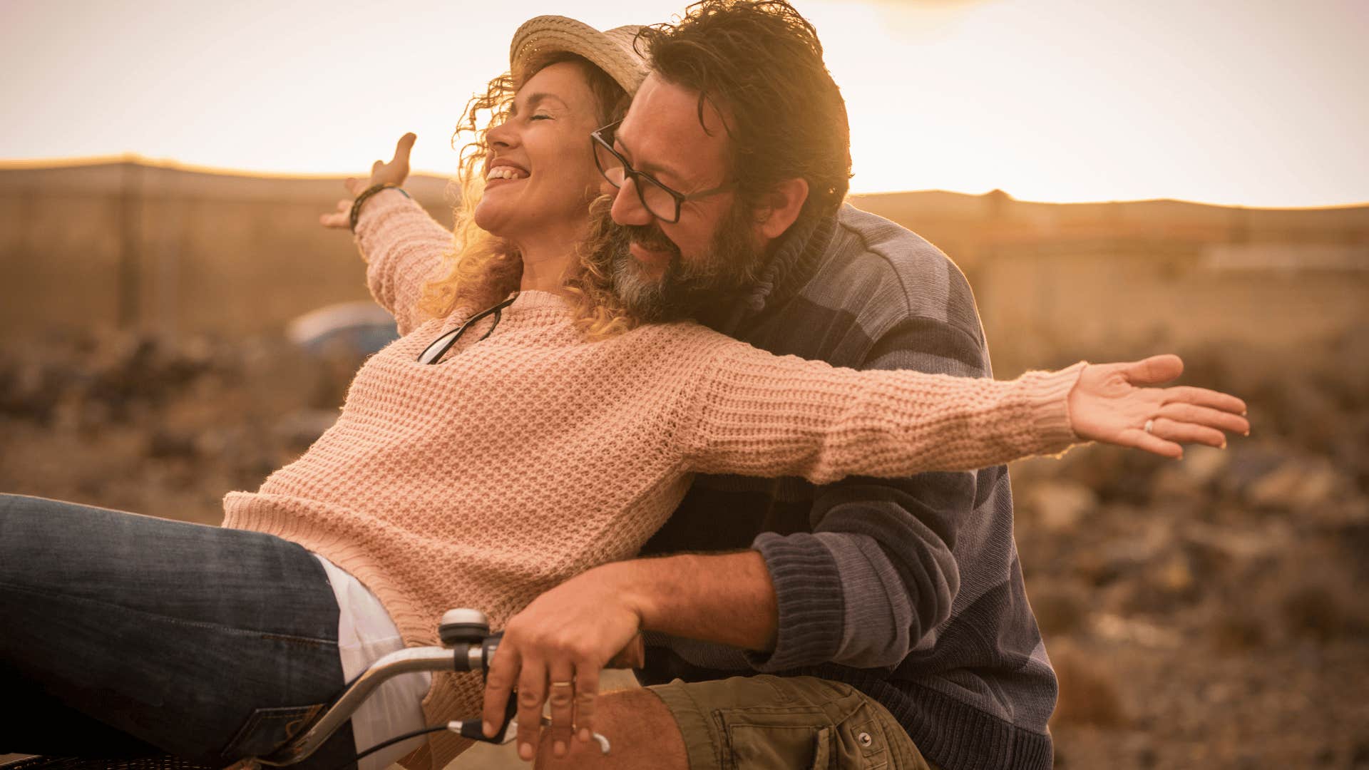 man and woman riding bicycle