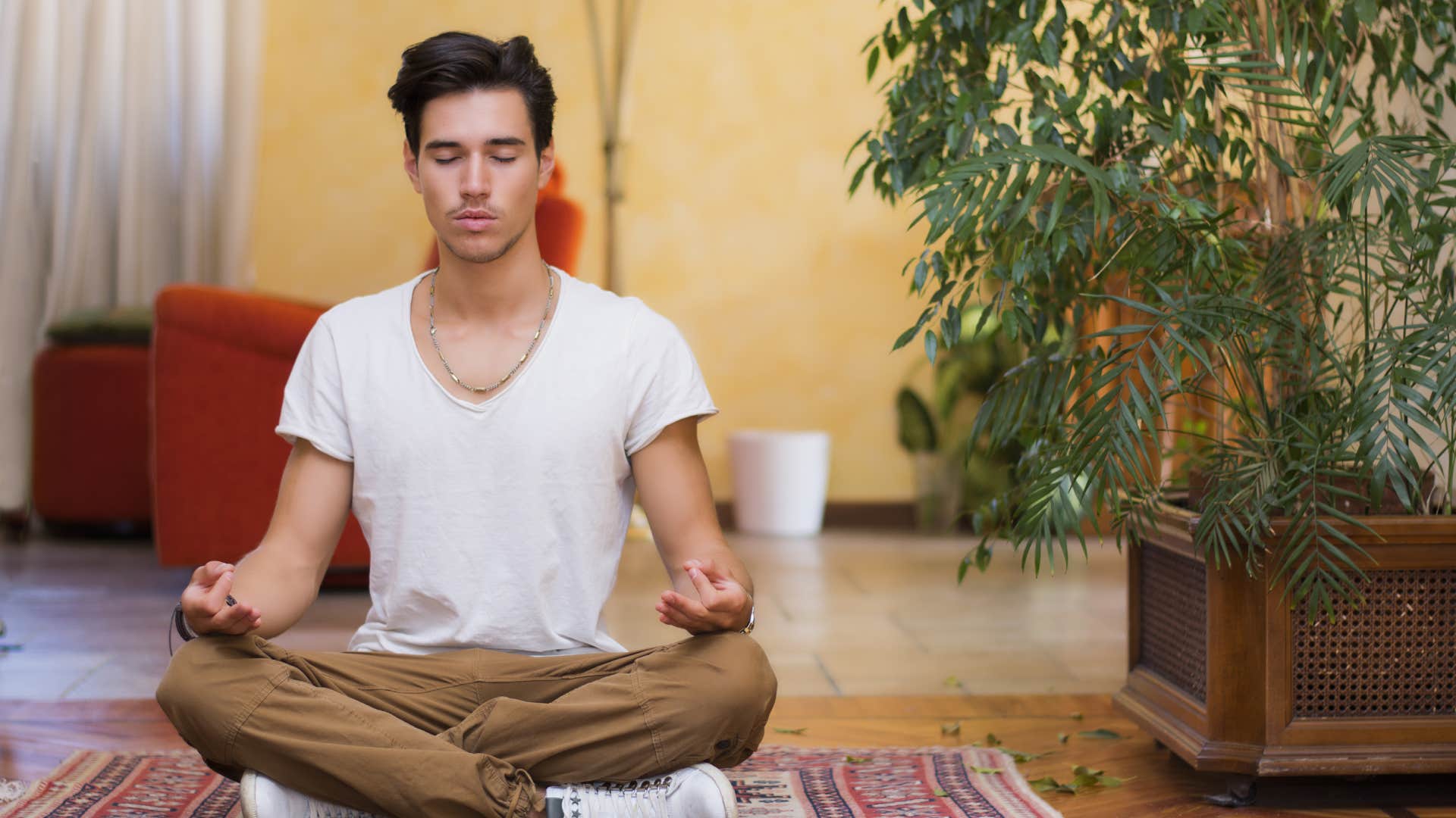 disciplined young man meditating