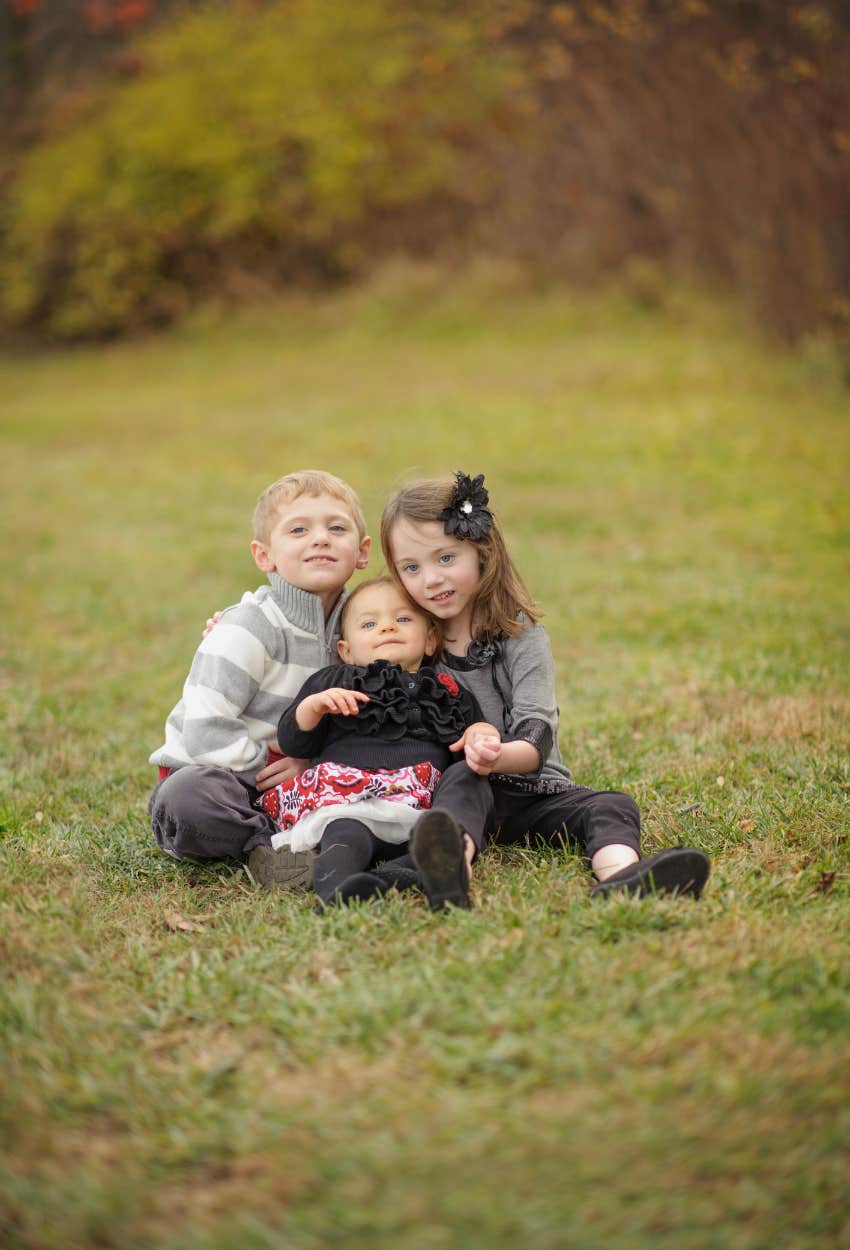 three siblings posed for a photo