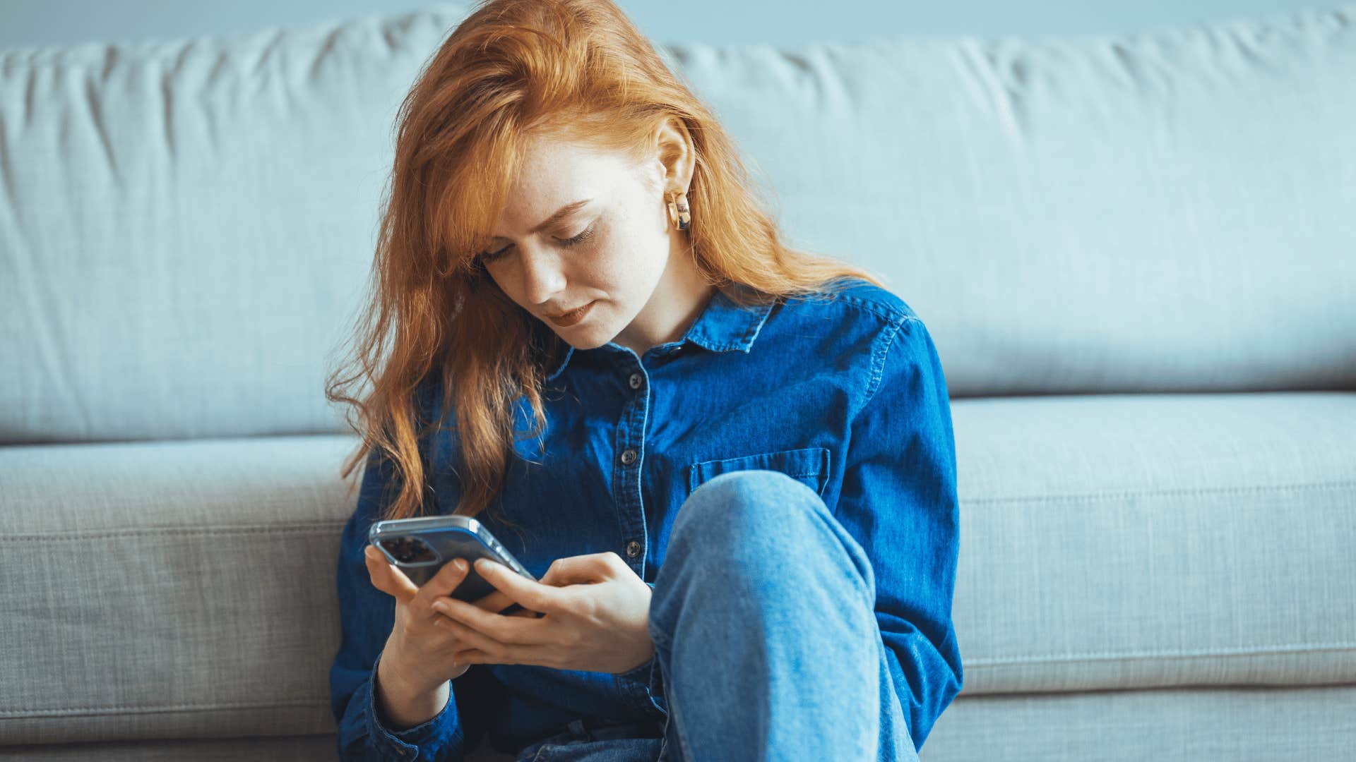 young woman texting on phone